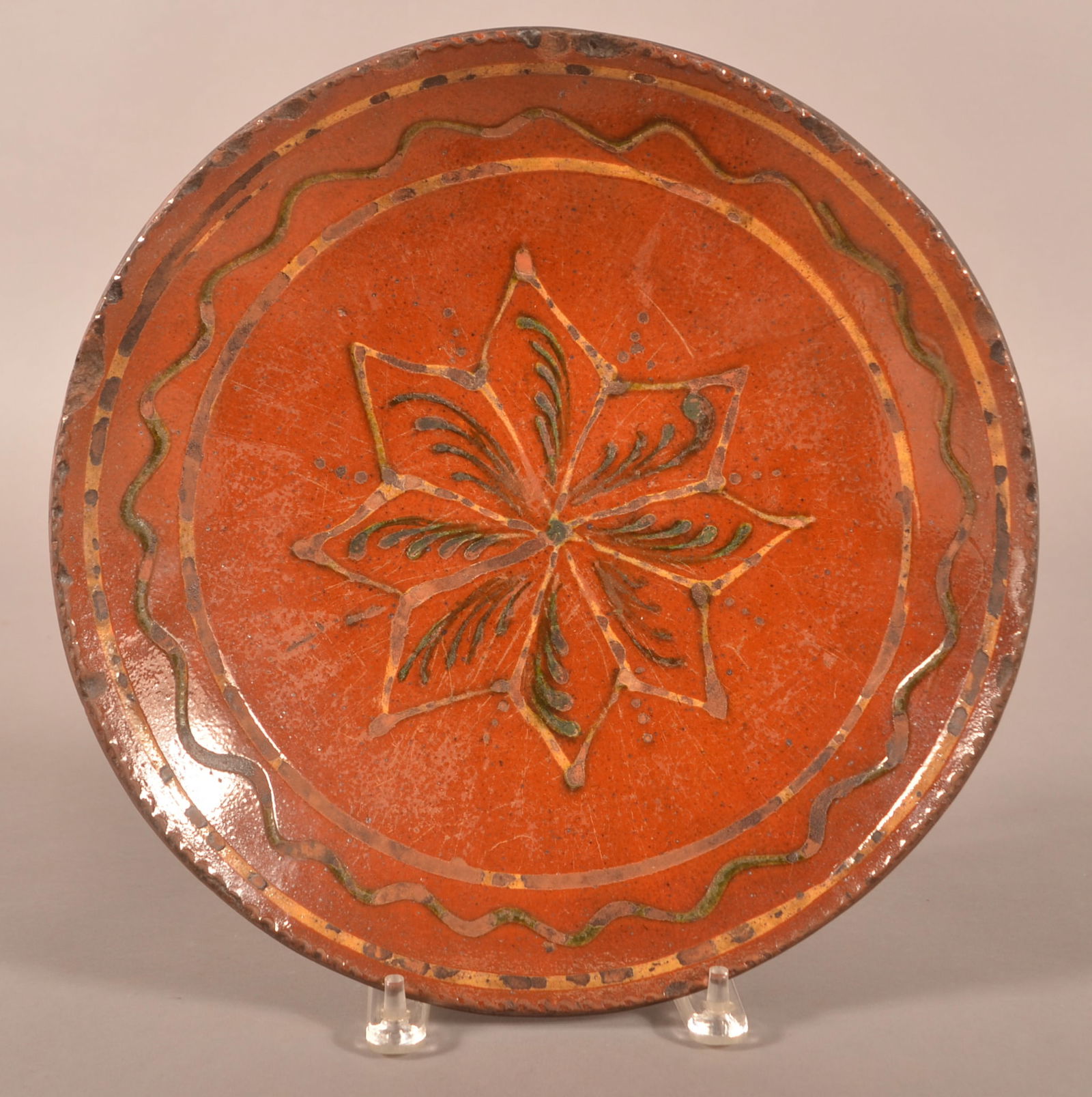 PA Redware Charger with Slip Star Decoration.: Pennsylvania Redware Charger with Slip Star Decoration. 19th century. Back stamped with "8". Provenance: The late Jan Paden, Duncannon, PA. 13" diam.