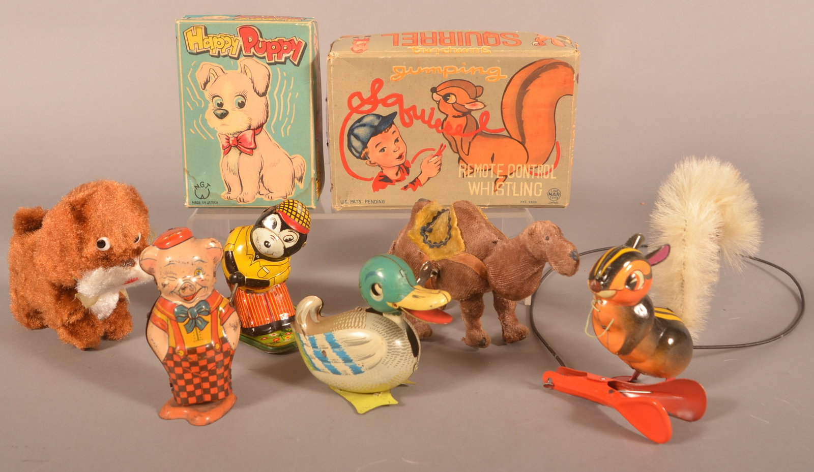 Six Vintage Tin and Fabric-Covered Wind-Ups.: Six Various Vintage Tin and Fabric-Covered Wind-Ups. Camel, 6-1/2"l.