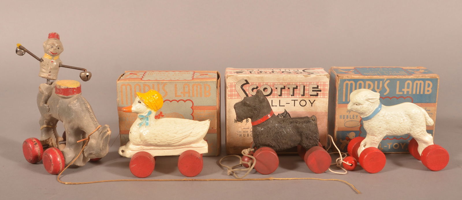 Four Vintage Composition Animal Pull Toys.: Four Vintage Composition Animal Pull Toys. Three in boxes marked Hubley. Monkey on donkey, 7-1/4"h.