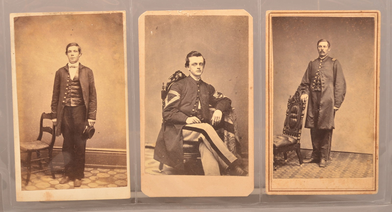 Group of 3 Union Civil War CDV's: Full standing view of Union private with WM Curry, Wilmington DE backmark. Seated view of a QM Sgt with trimmed corners. Backmark by J S Medlar, Woodstock Illinois. Full standing view of company grade