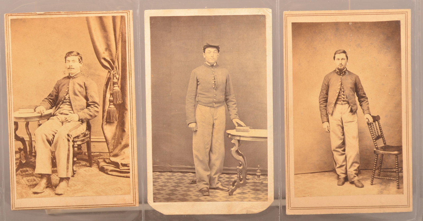 Small Group of Pennsylvania Civil War CDV's: Each wearing artillery or cavalry shell jackets. Seated view with NCO stripe on pants and corporal stripes backmarked Burnite and Weldon, Harrisburg PA. Full standing view of private with Matteson, Mi