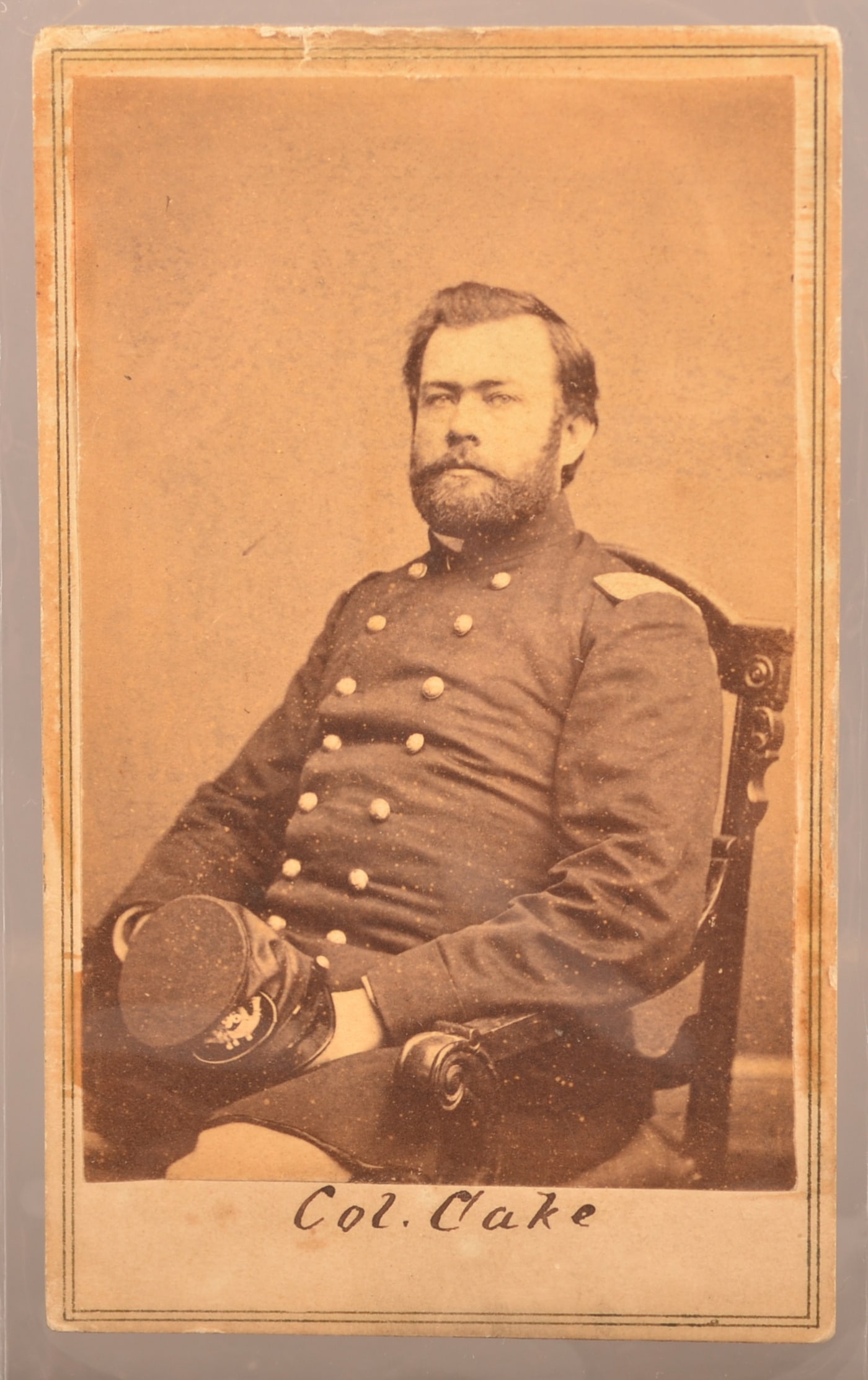 CDV of Col. Henry Cake, 25th & 96th Penna.: Great seated view, ink signed on front "Col Cake" holding his McDowell pattern officer's forage cap. Photo by Anthony/Brady. Similar image on Civil War Photosleuth.