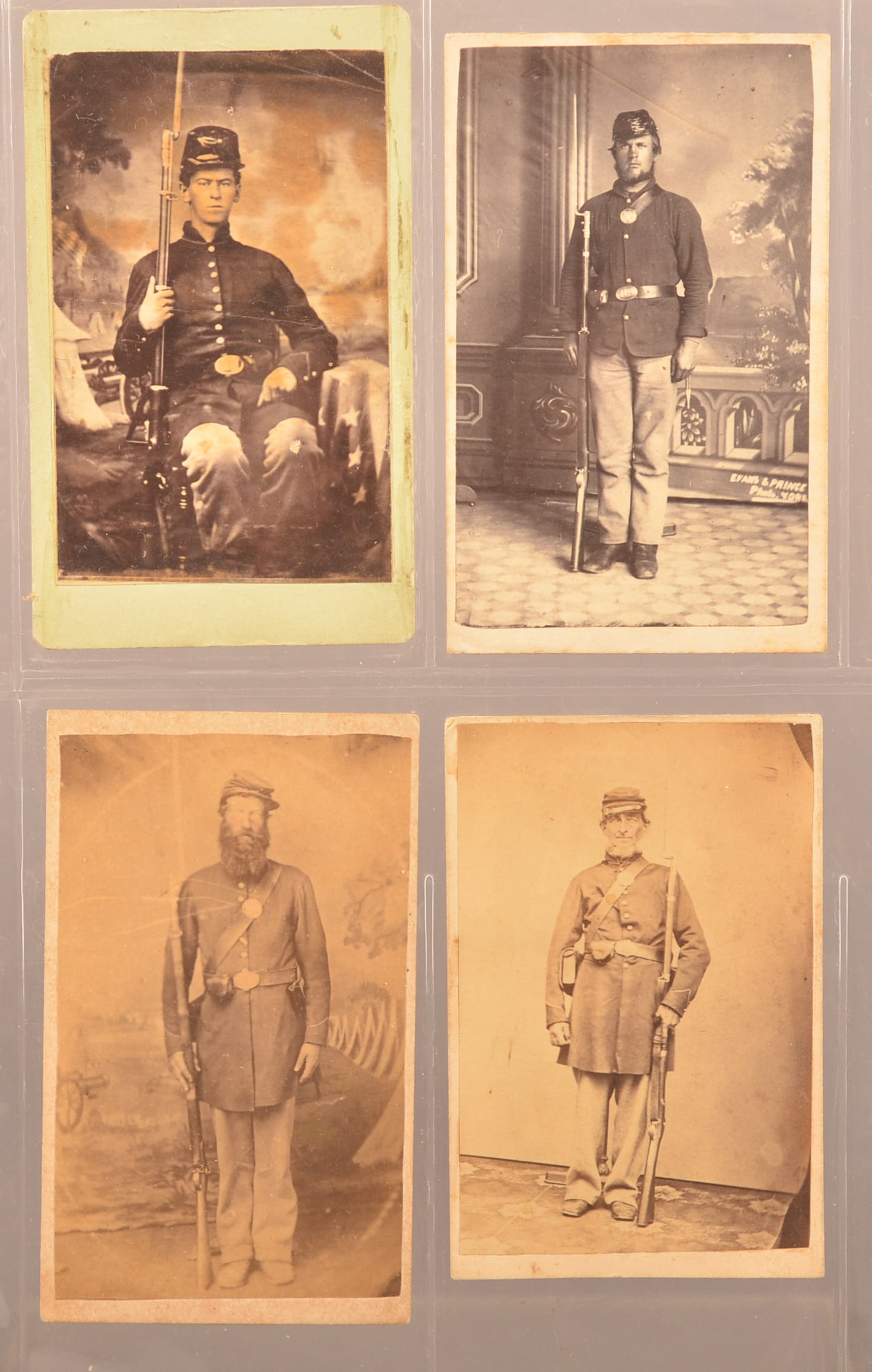 Group of 4 Images of Armed Civil War Soldiers: Seated view copy shot of private in front of a painted backdrop taken by Wood, Wellsboro Pa. Full standing view of infantryman in sack coat taken by Evans and Prince, York Pa...photographers mark pain