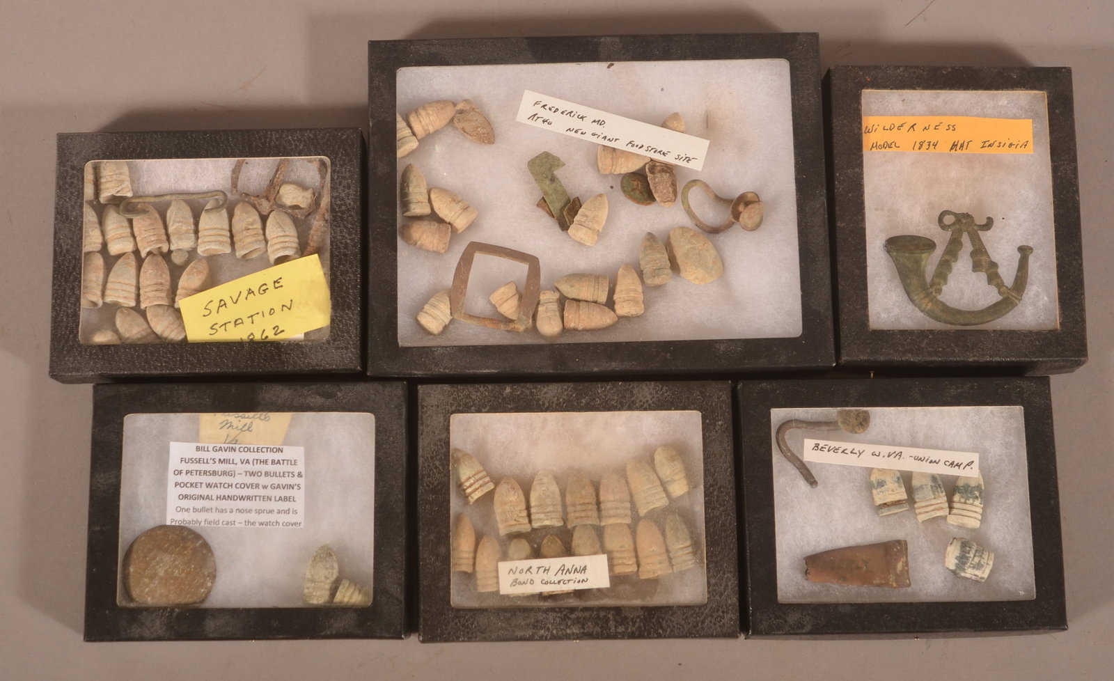6 Riker Cases of Dug Civil War Relics: Assortment of relics including a very nice 1834 hat insignia dug at the Wilderness Battlefield.