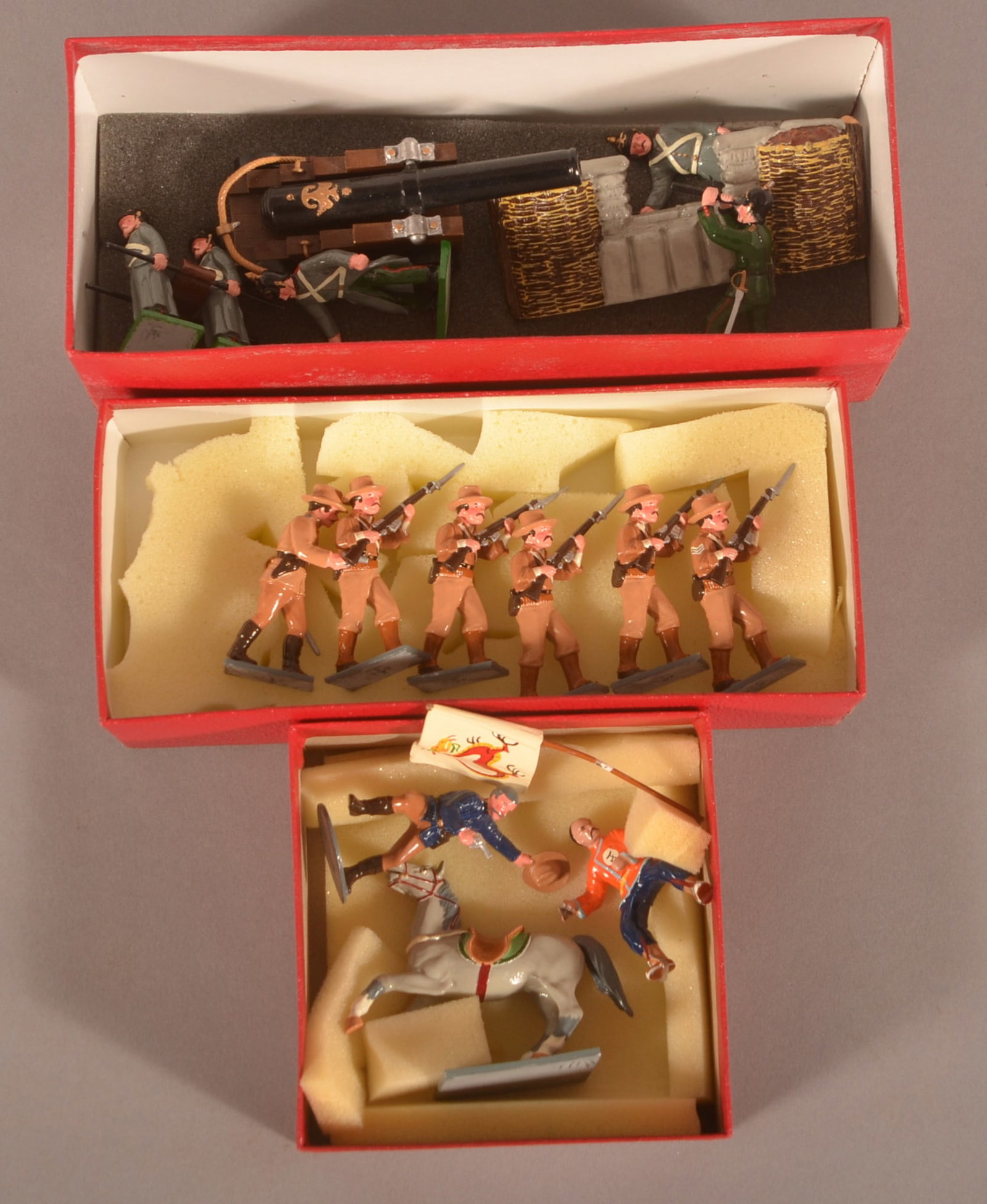 3 Soldiers Of The World Trophy Miniatures Sets: Painted lead soldier sets include Set BS 29 "US Army China", (No set #) US Marine Officer with Boxer on horseback & flag and Set CWS8 Russian Heavy Artillery piece with 5 man crew.