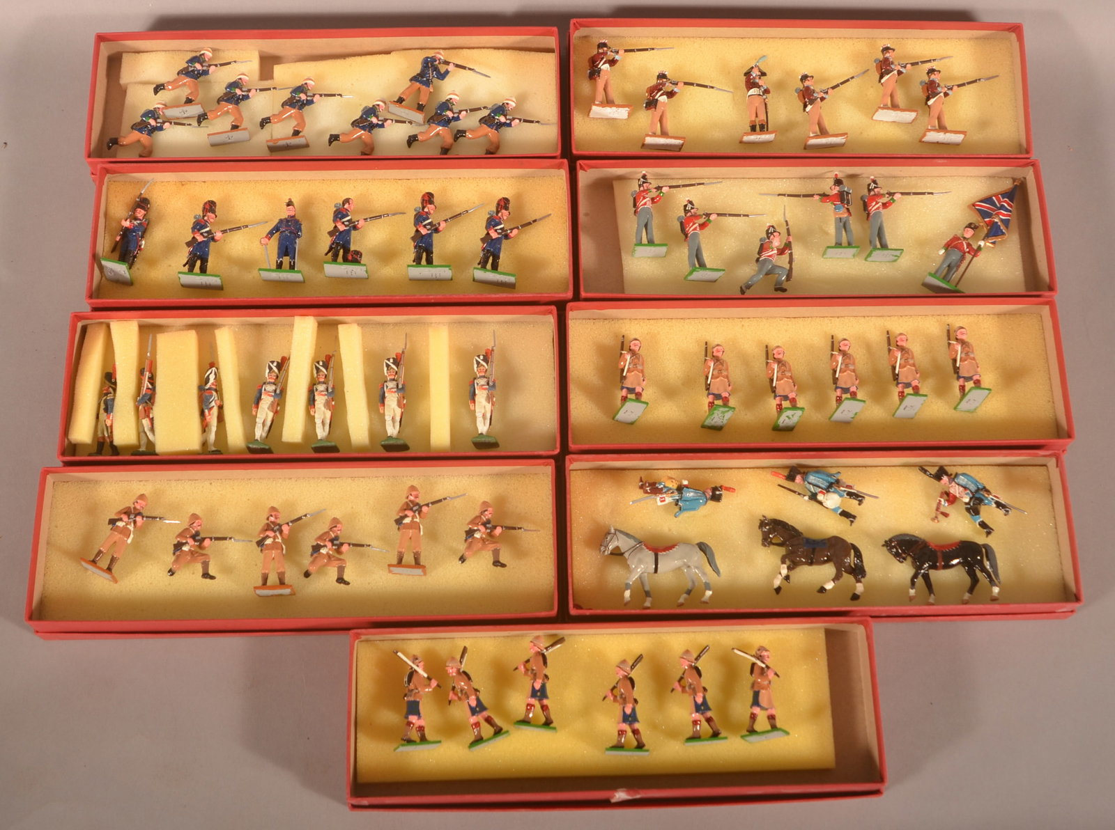 9 Boxes of Trophy of Wales Miniature Soldiers: Not in the original boxes, similar to previous lot. Groups of soldiers from the Napoleonic Wars, Waterloo, Boer War and Sudan.