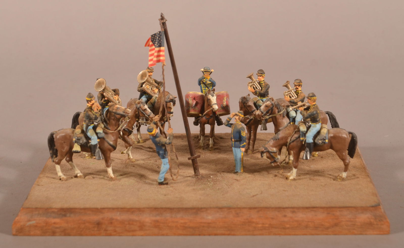 Civil War Cavalrymen Painted Miniatures Display: Scene featuring the raising of the US Flag with the cavalry band on horseback.