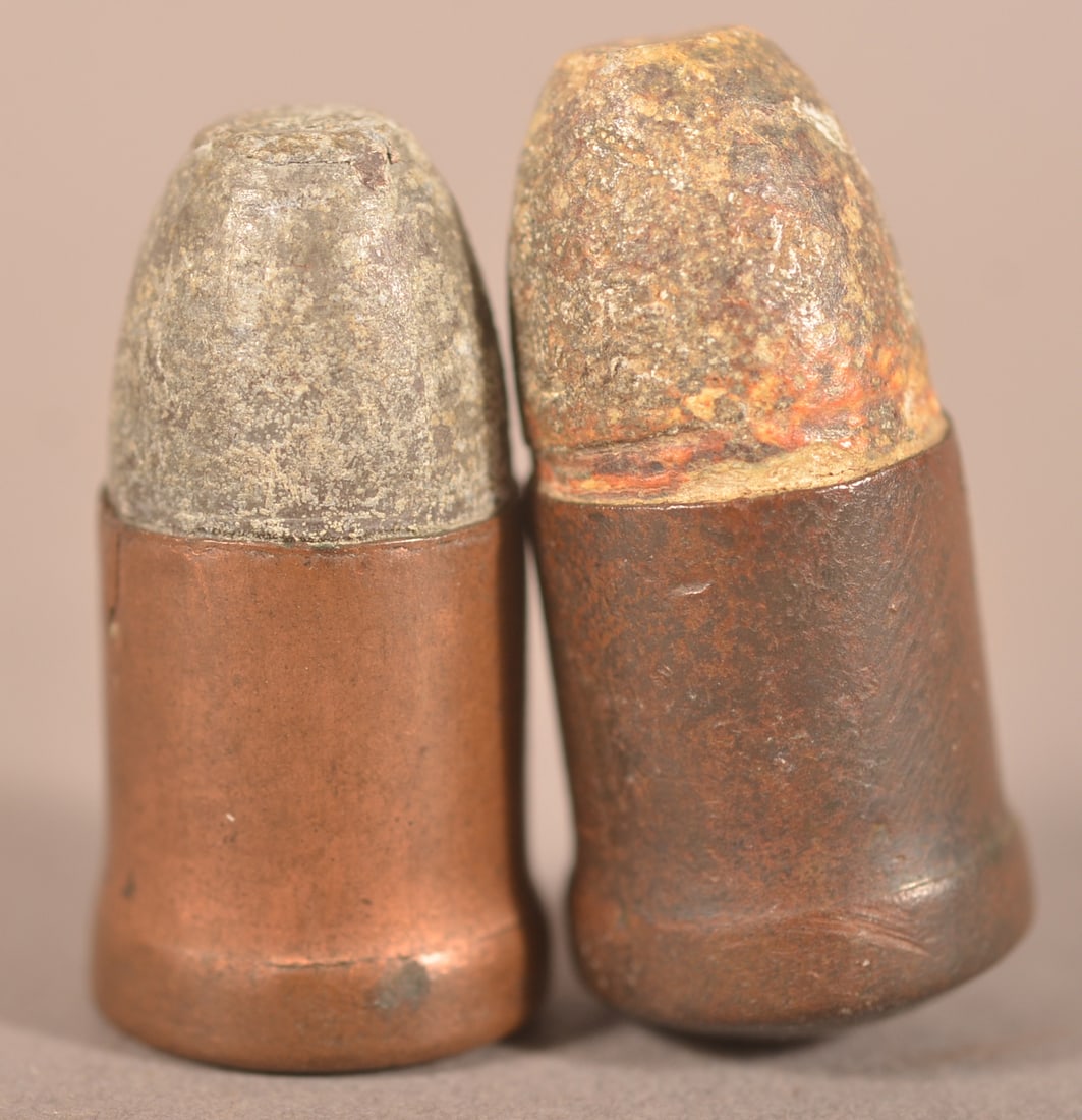 (2) 12mm Perrin Cartridges: As-found recovered condition.