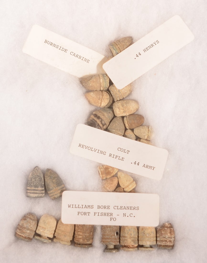 Riker Mount of Recovered Bullets: Includes Merrill and Burnside carbine bullets, Colt revolving rifle bullets and Williams bore cleaner bullets, as-found recovered condition.