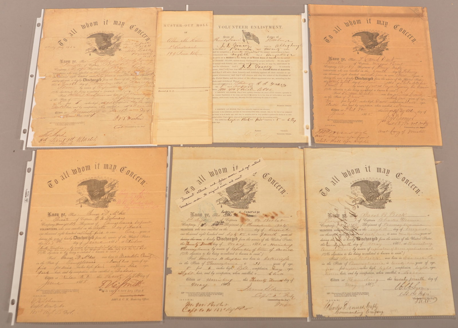 Discharge Papers, Muster Out Roll and Enlistment: Age discoloration, color-fading and normal, expected wear.