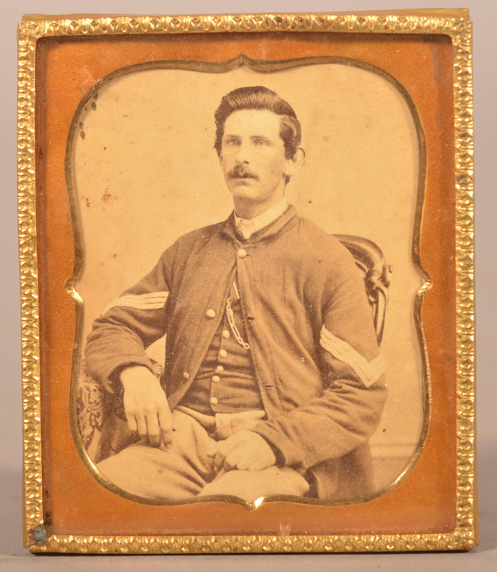 Framed Cabinet Card of Seated Union Officer: Cut down cabinet card mounted in a gilt- plated frame, measures 2-3/4" x 3-3/4", clear image with minor wear.