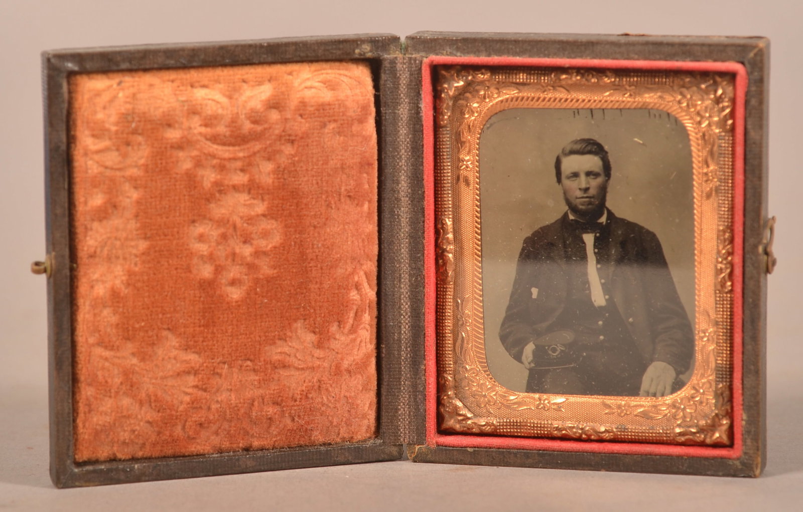 1/9th Case Tintype of Union Soldier: Clear seated image in full uniform with kepi hat, expected finish and age wear to the case.