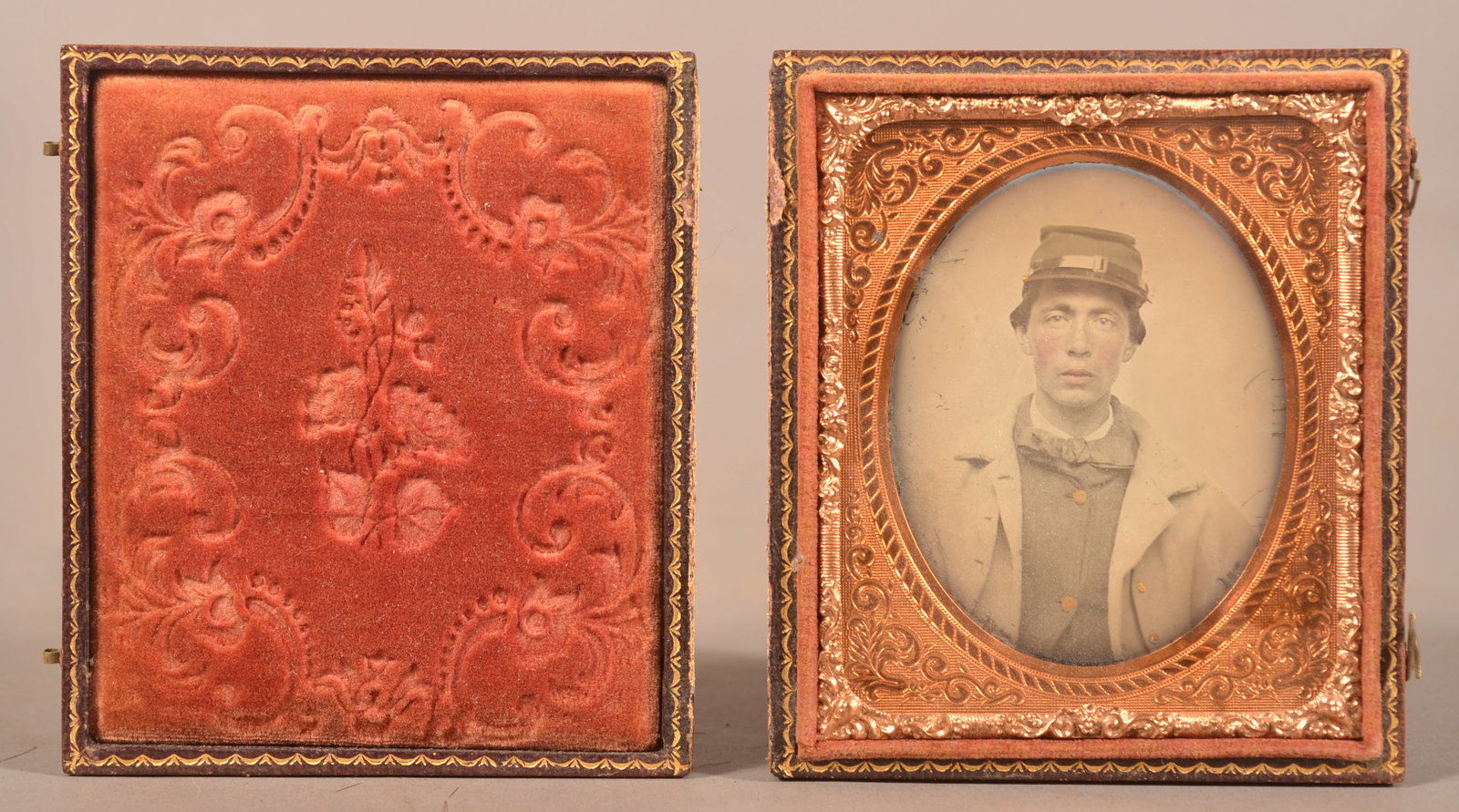 1/9th Cased Ambrotype of Union Soldier: Clear image of soldier in full uniform with a tape-repaired case cover, normal finish wear and signs of age.
