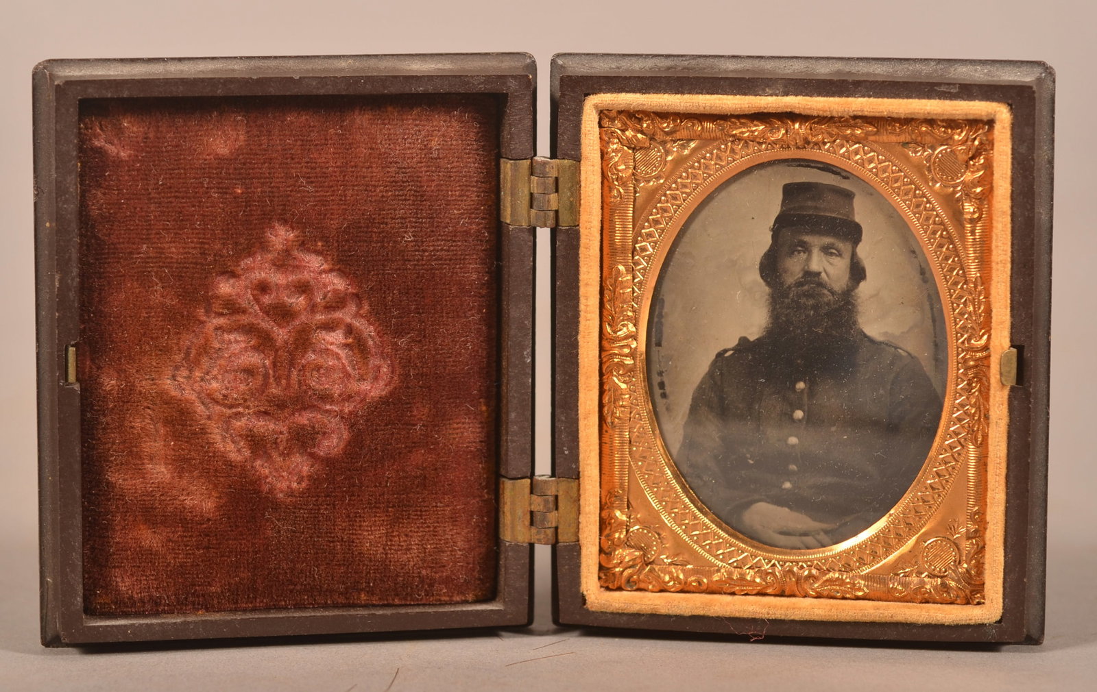 1/9th Cased Tintype of Seated Union Soldier: Seated image wearing full uniform, expected finish and age wear.