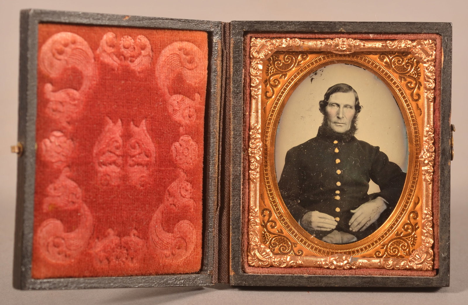 1/9th Cased Ambrotype of Seated Union Officer: Clear image with minor loss to the upper side of the image, normal wear and signs of age.