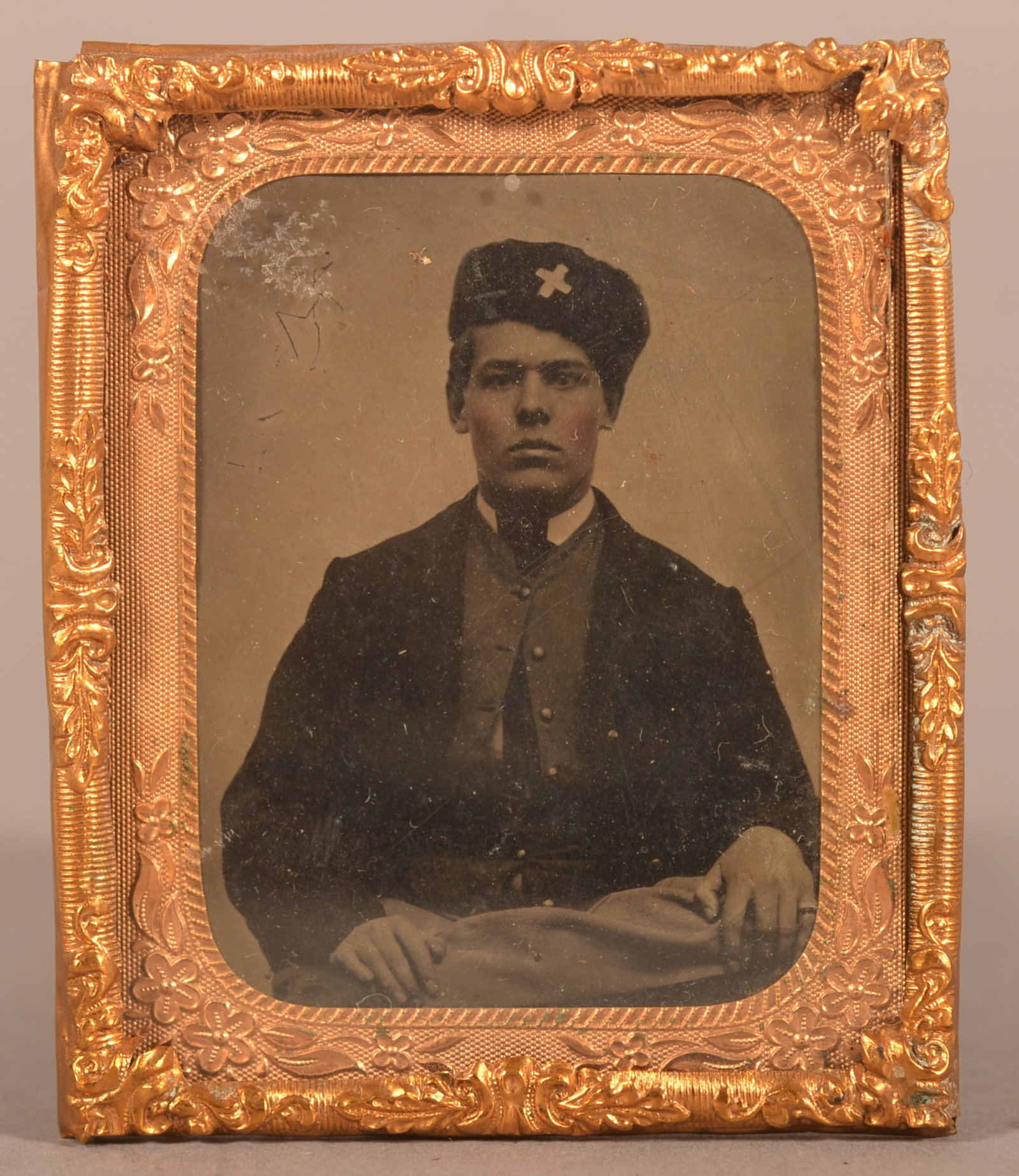 1/9th Plate Tintype of Seated Union Soldier: Wearing 6th Corp. badge. Clear image with minor fading and wear, is missing case, overall good condition considering its age.