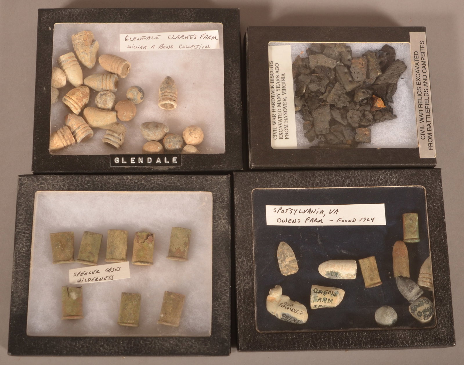 4 Riker Mounts of Dug Civil War Relics: Includes Spencer cases, assorted minie balls and bullets, and hardtack. As-found recovered condition.