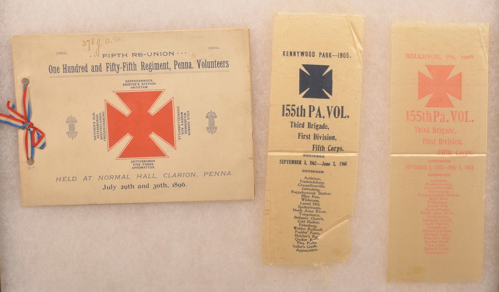 155th Pa. Vol. Infantry Reunion Ribbons: Includes program. Minor age discoloration with creases and folds, loose threads appearing around the edges, overall fair condition.