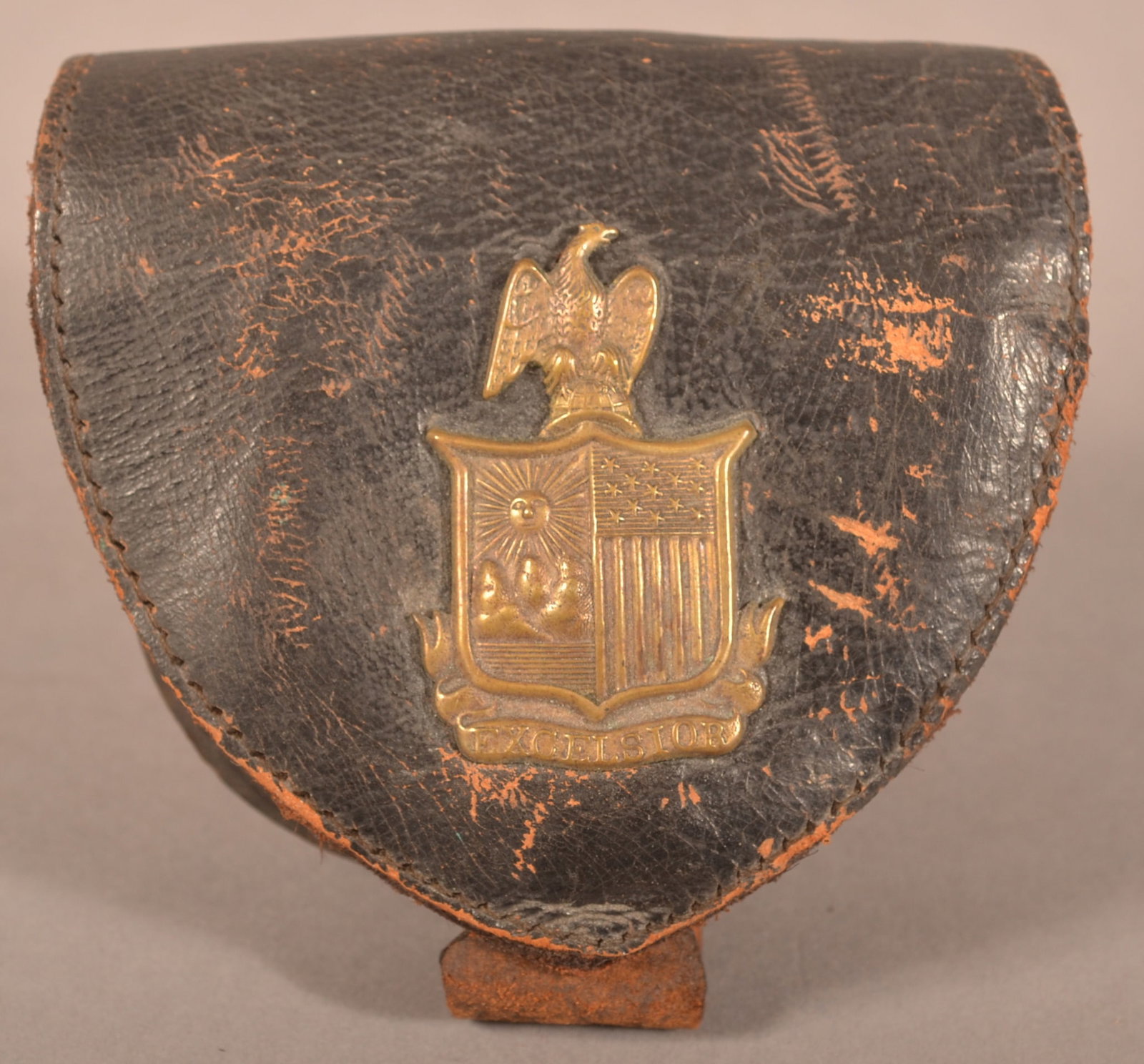 New York National Guard Percussion Cap Box: Intact leather latch strap with a single belt loop, dry age cracked leather with areas of flaking, leather is dry but is still supple, overall fair condition.