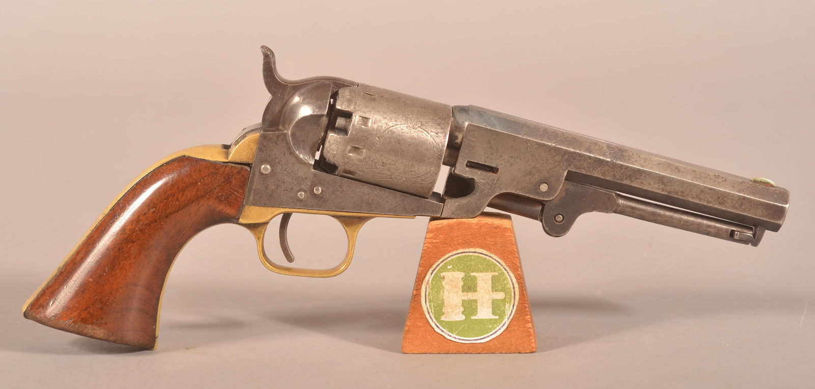 Manhattan Arms Navy-Type .36 cal. Perc. Revolver: SN 25523, Manufactured in Newark NJ between 1859-1868, single-line makers marks and address on top of the barrel, 5-shot engraved cylinder of floral and Naval scenes, engraving is worn and faint, corr