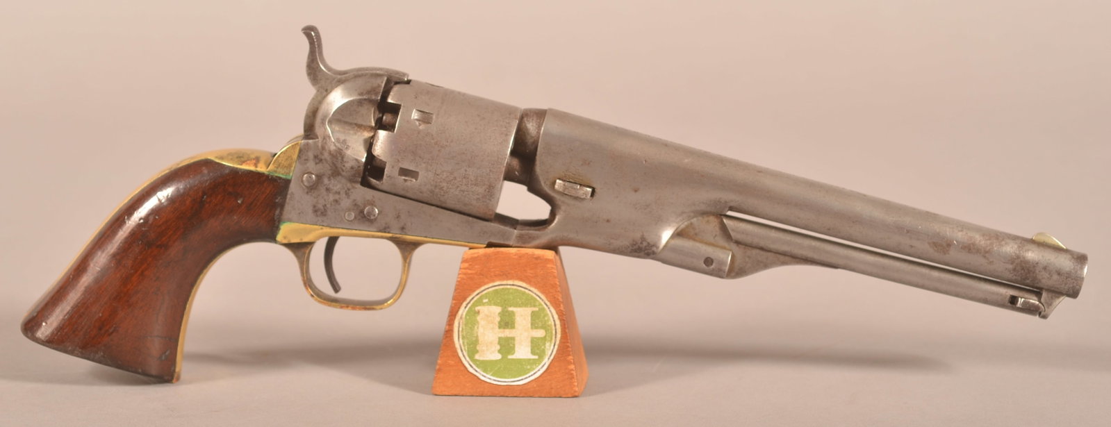 Colt mod. 1861 Navy Revolver: SN 14328, 7-1/2" barrel with single-line name and address stamped on the barrel, faint worn engraved Naval scene on the cylinder, brass trigger guard and back strap, Colt's patent appearing on the rig