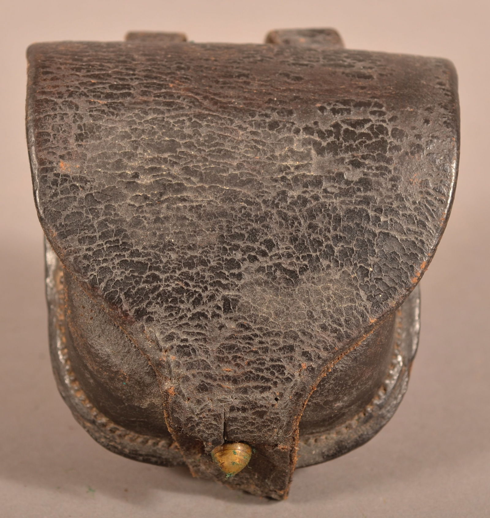 US Arsenal St. Louis Percussion Cap Box: Visible maker's mark on the inner flap, supple leather with excessive age crazing and wear, areas of finish flaking with some age cracks, overall fair condition.