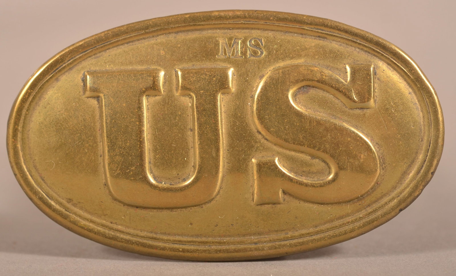 Pattern 1839 Mass. Surcharged Infantry Belt Plate: Die-struck rolled brass face with a lead-filled back, intact belt hooks, no visible maker's mark, declared obsolete by the Army in 1857 these plates continued to be ordered by several states including