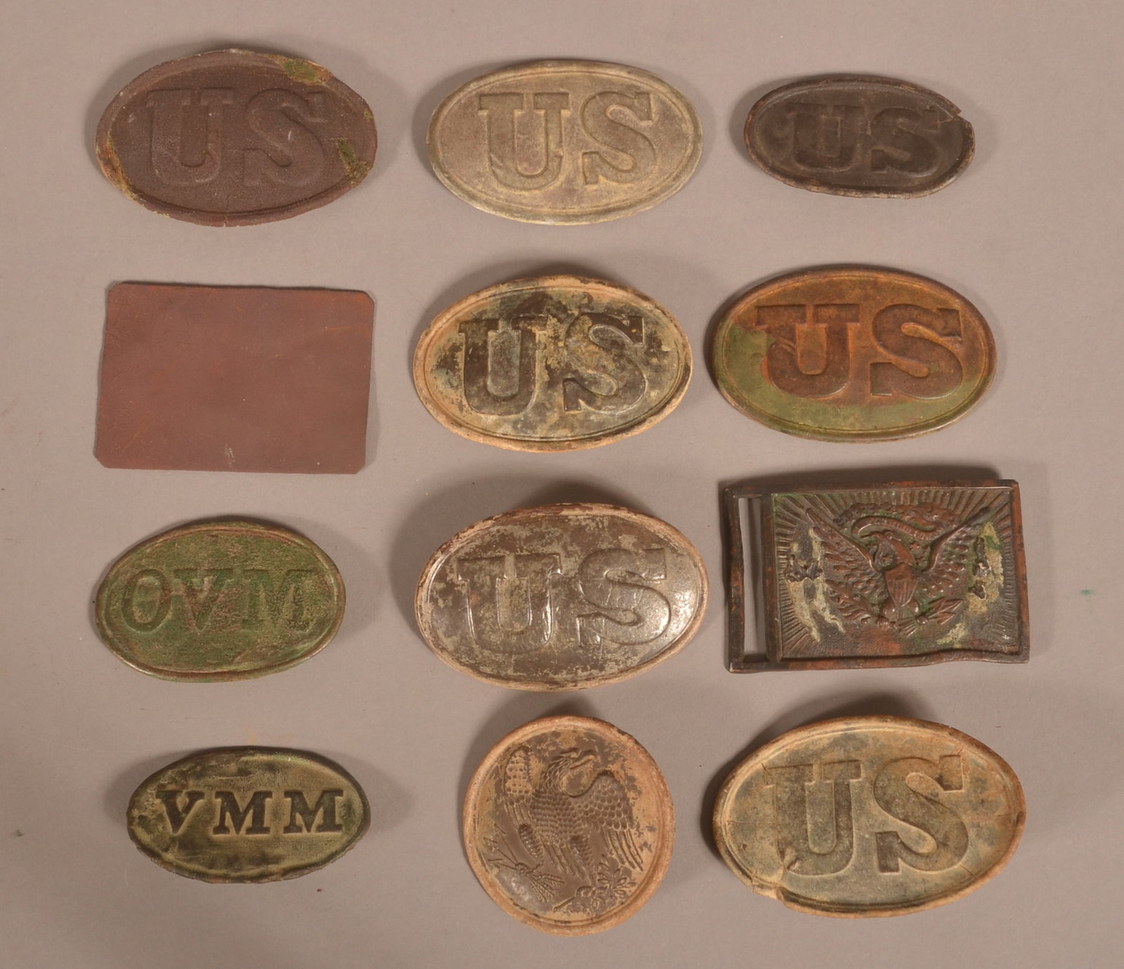 12 Relic Belt and Box Plates: As-found relic condition with consignor stating where some were recovered.