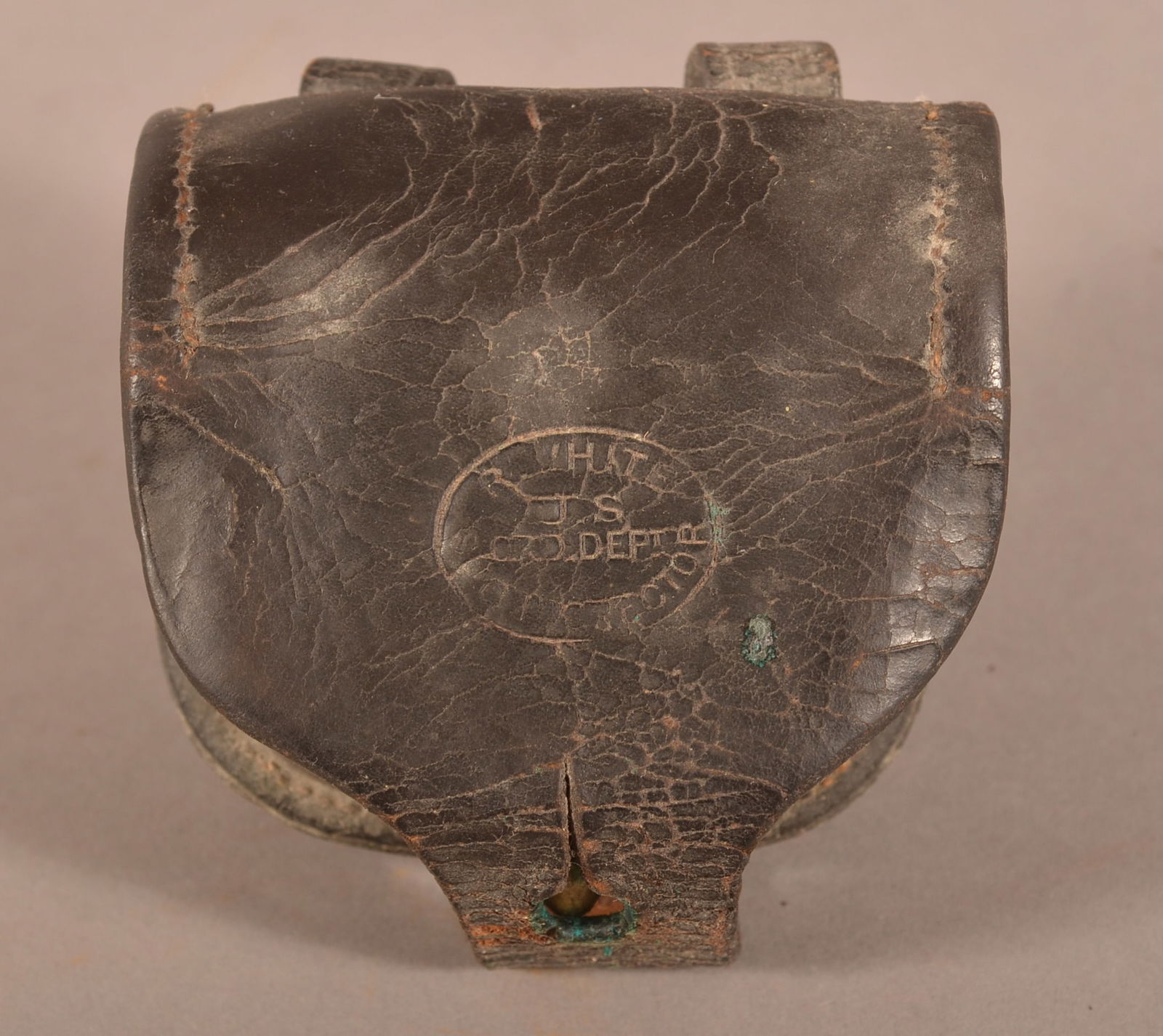 Baker & McKinney Percussion Cap Box: Faint worn makers mark on the back side, intact belt loops and stitching, excessive age cracks and crazing, aged leather patina that is still pliable, overall fair to poor condition.