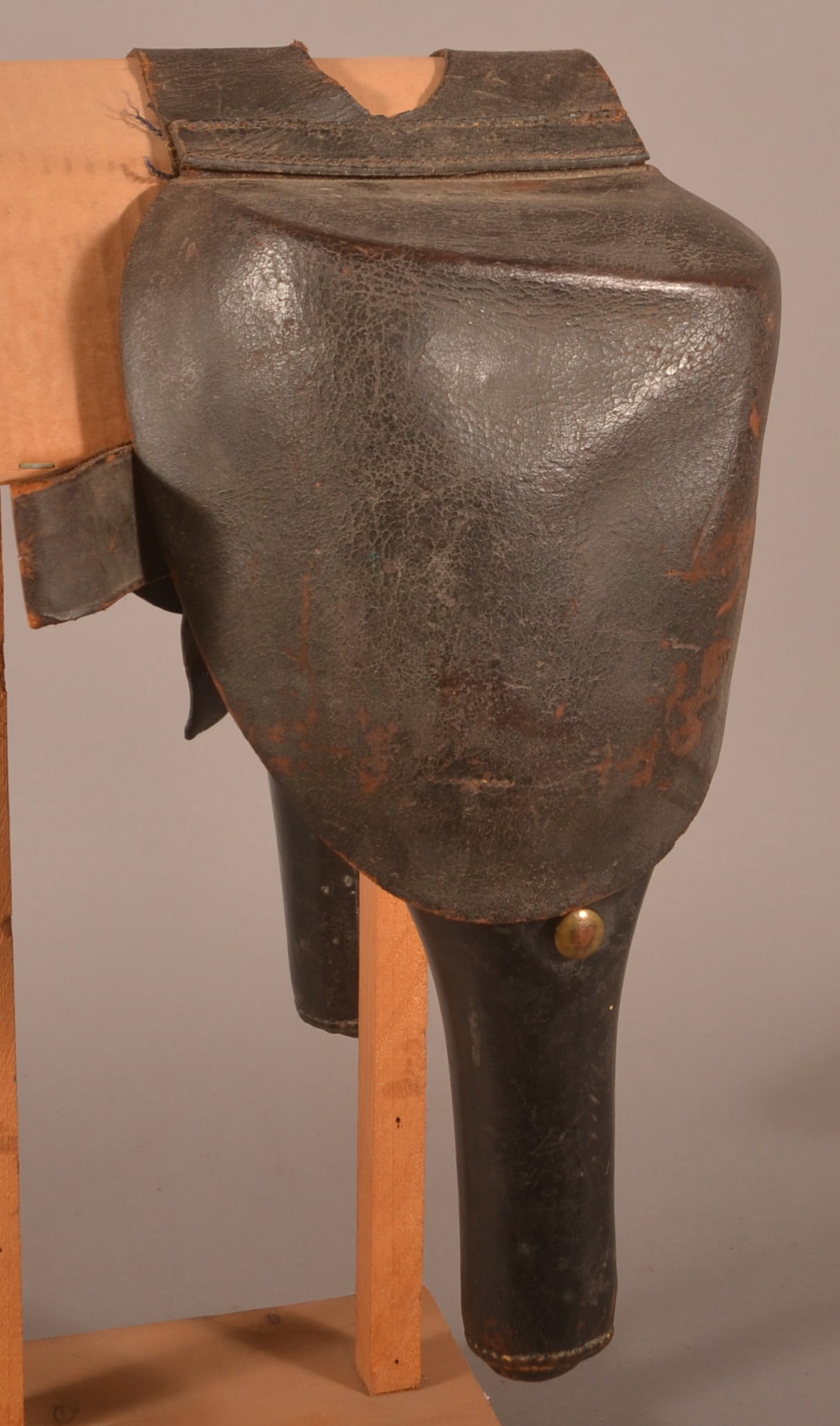 Colt Dragoon Saddle Holsters: Faint and worn Inspector's mark on the pommel strap, heavy leather construction containing both sets of cartridge tins, separated and missing leather latches, aged finish with leather that is still pl