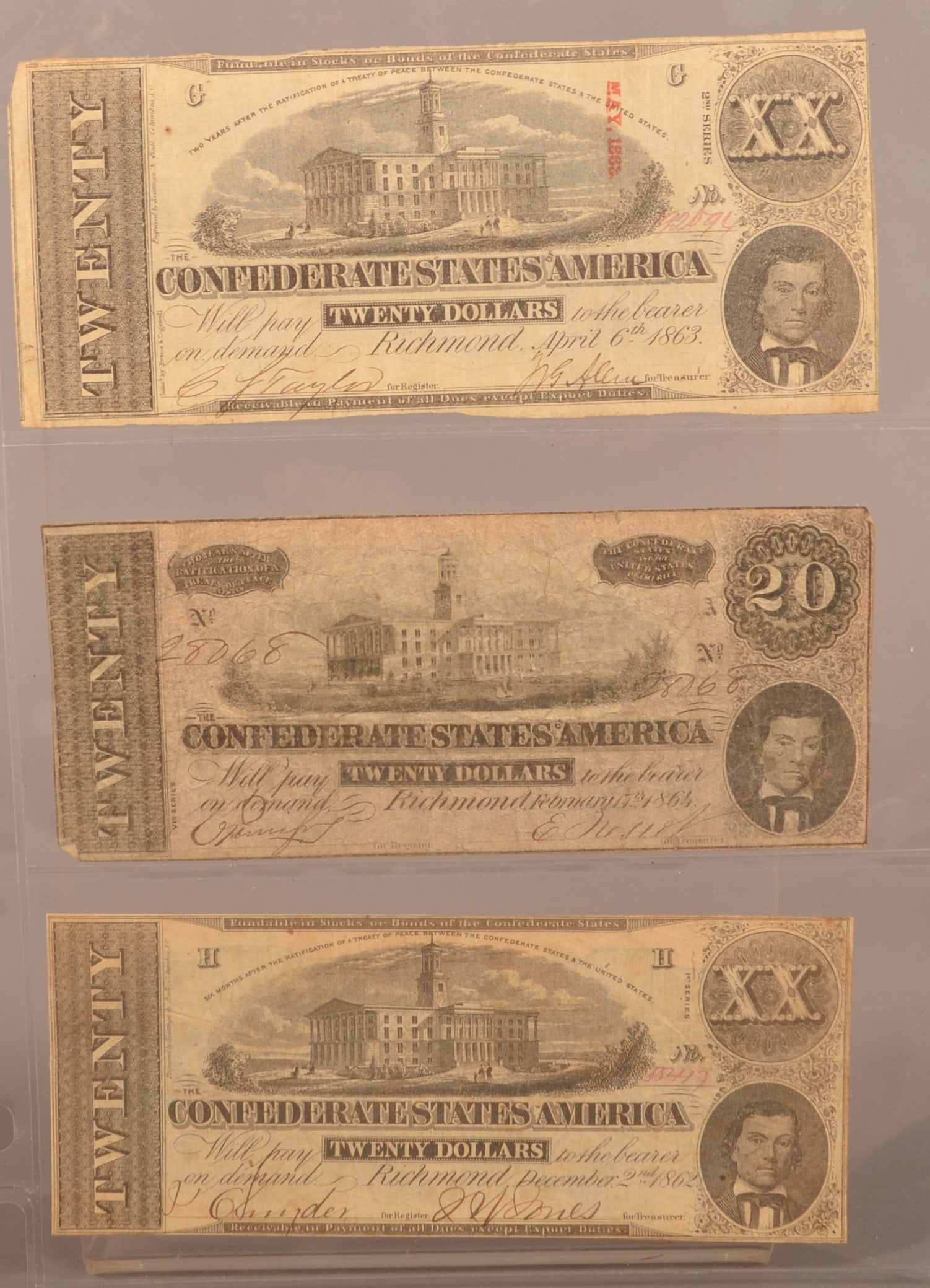 3 Confederate $20 Bills: Dated 1862, 63, 64, handwritten treasury signatures and serial numbers, normal creases and folds, expected color toning, small loss and roughness around the edges, overall fair condition.