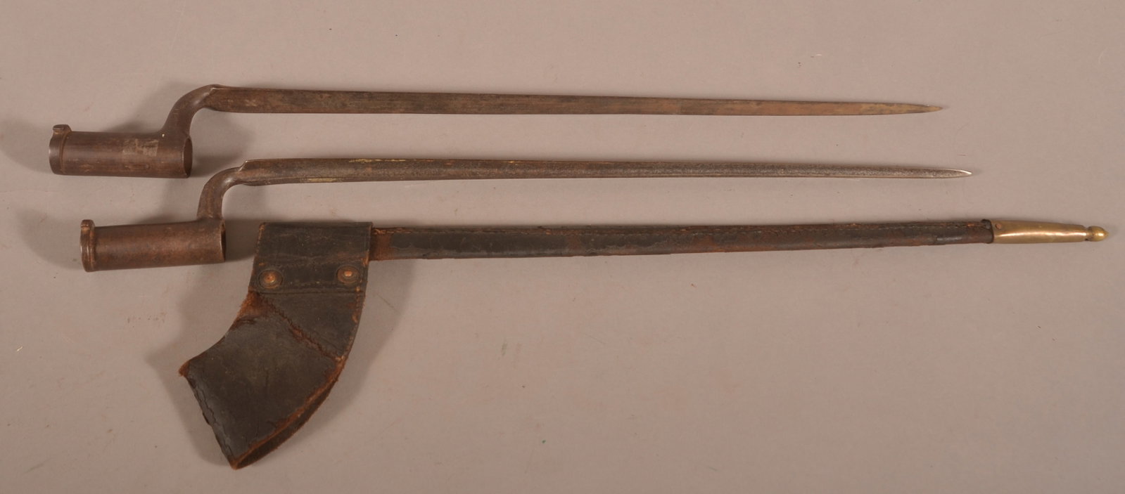 2 Prussian mod. 1809 Potsdam Socket Bayonets: Dark brown, faded, and oxidized metal surfaces, visible Prussian proof marks, one bayonet includes a leather scabbard that shows excessive finish flaking and age crazing, overall fair to poor conditio