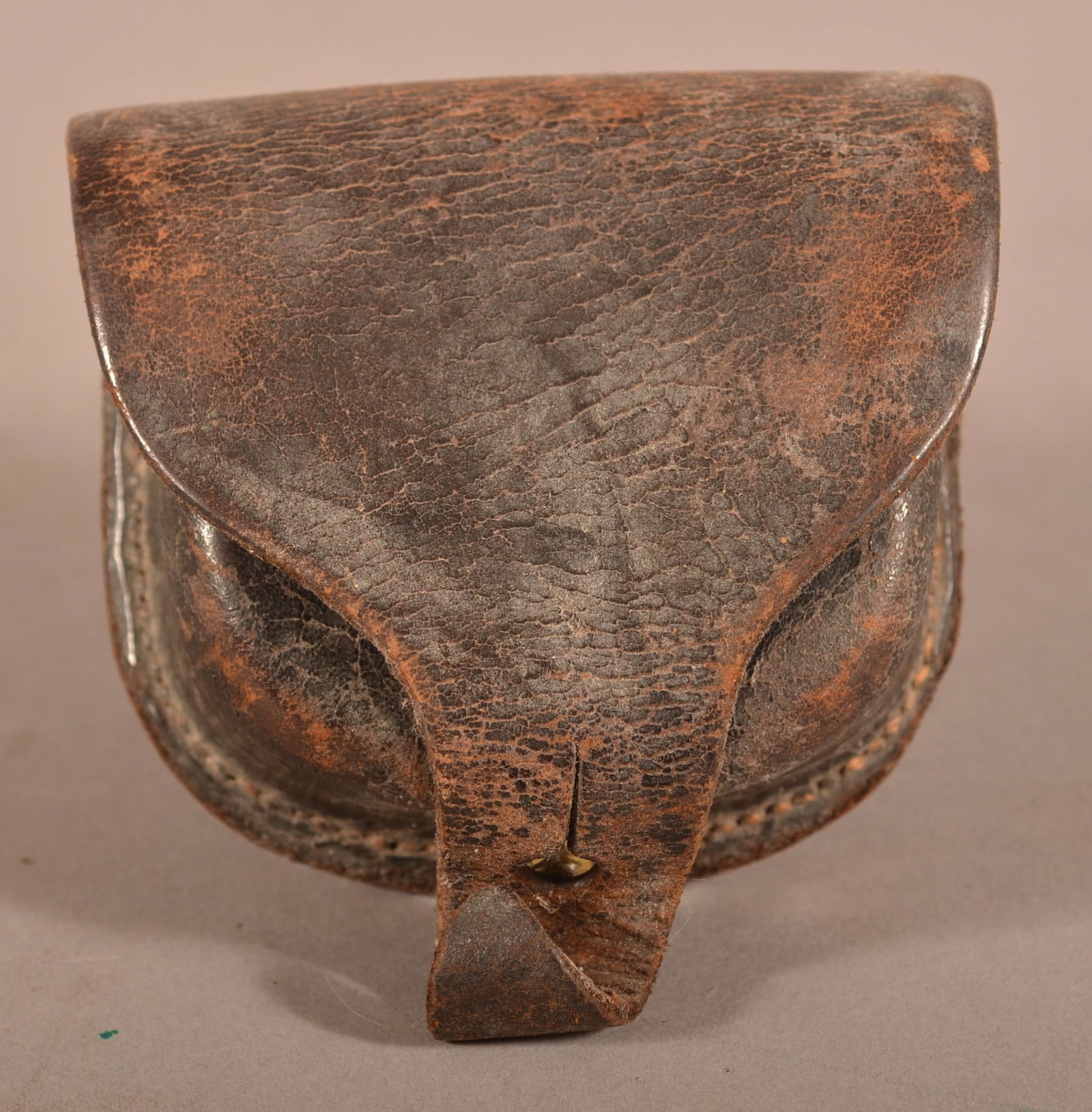 E. Gaylord Percussion Cap Box: Visible makers mark on the inner flap, excessive age crazing with flaking and scuff marks, intact stitching and belt loops, no interior wool is present, overall fair condition.