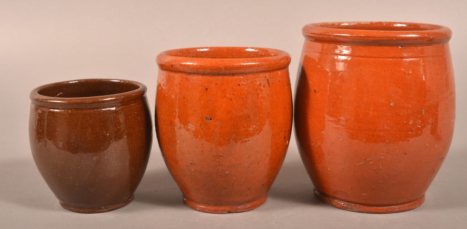 Three PA 19th C. Glazed Redware Storage Jars.: Three Pennsylvania 19th Century Bulbous-Form Glazed Redware Storage Jars. 4" to 6"h.