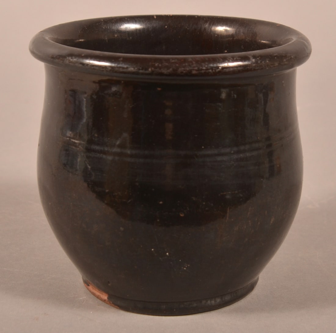 L. Kopp Glazed Redware Storage Jar.: L. Kopp Glazed Redware Storage Jar. Stamped on base "L. KOPP", Lineboro, MD, ca. 1875. Ovoid jar with tooled shoulder and rounded rim. 4-5/8"h.
