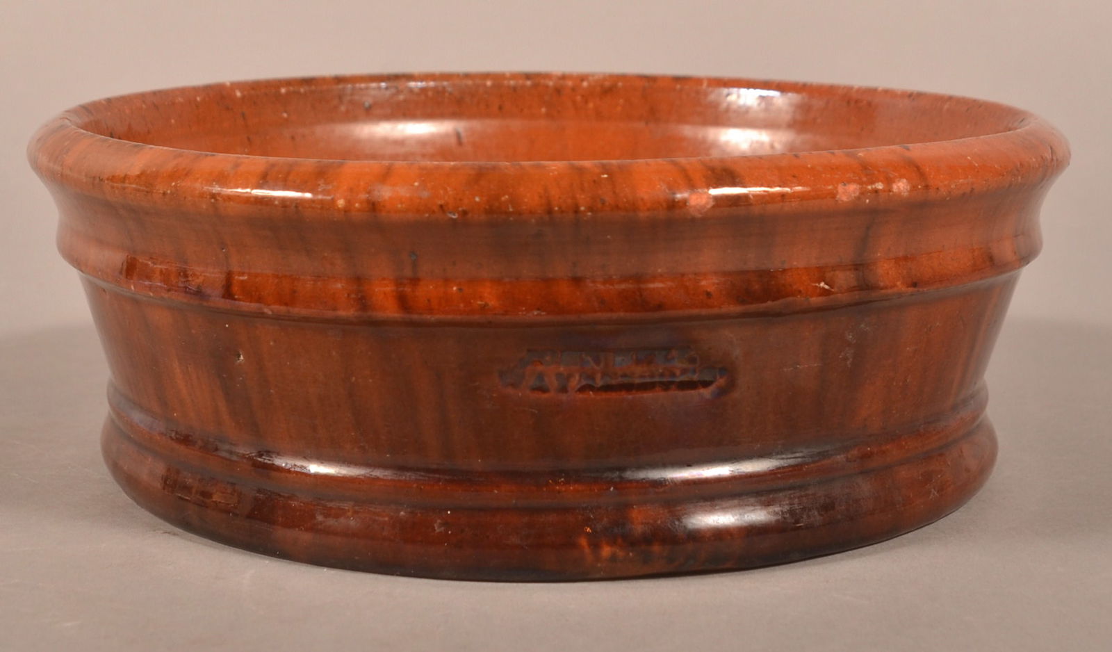 John Bell, Waynesboro, PA Redware Shallow Bowl.: John Bell, Waynesboro, PA Mottled Glaze Redware Shallow Bowl. Flared molded sides and molded base. 3-1/4"h. x 9-1/4" diam.
