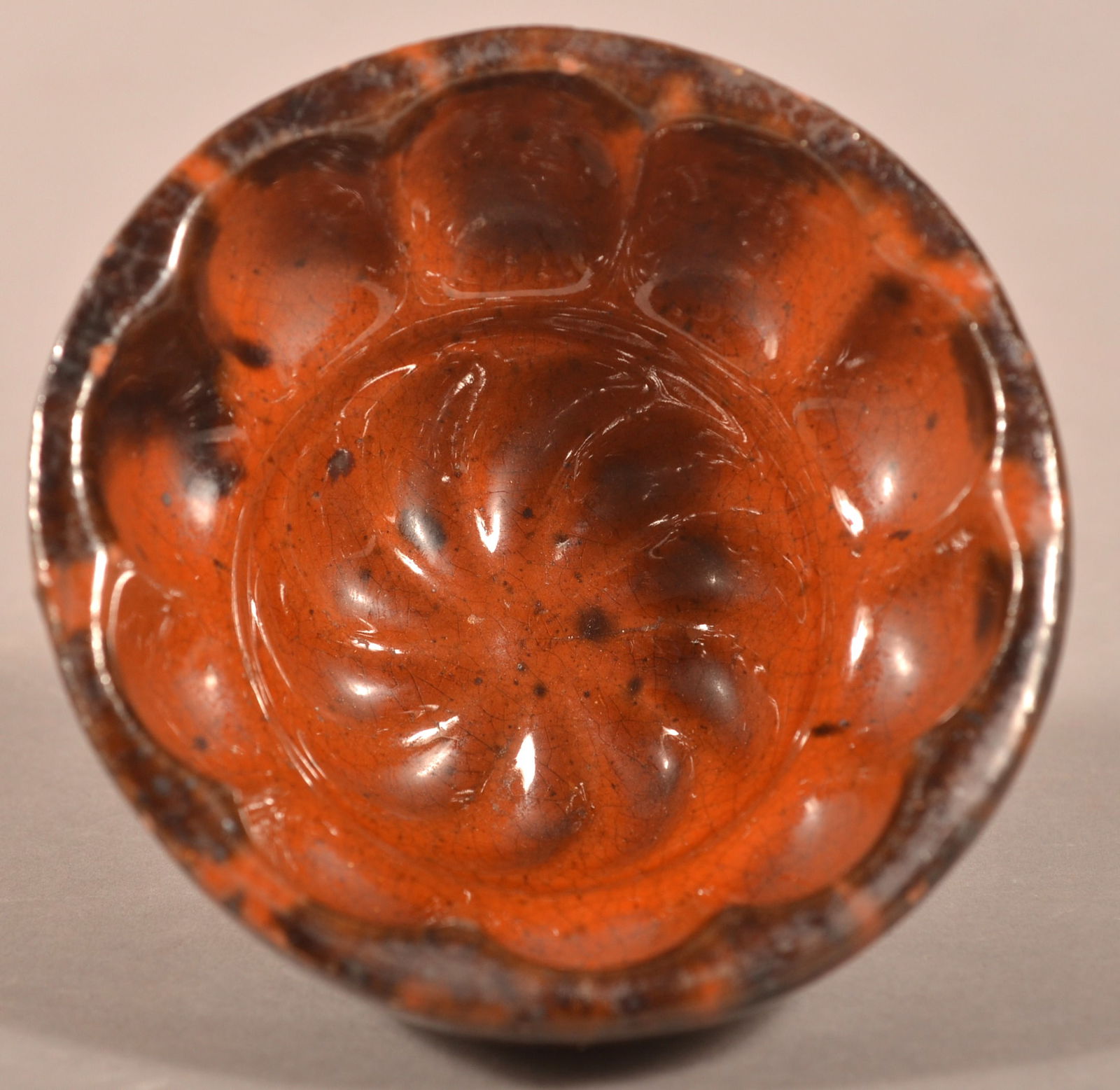 PA 19th C. Mottled Glaze Redware Jelly Mold.: Pennsylvania 19th Century Mottled Glaze Redware Jelly Mold. Radial design with scalloped rim. 2"h. x 4" diam.