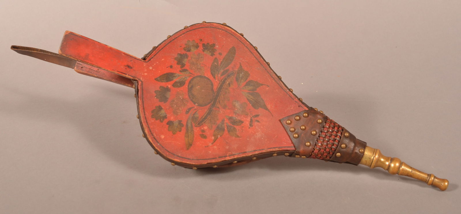 19th Century Paint-Decorated Fireplace Bellows.: 19th Century Paint-Decorated Fireplace Bellows. Spade form, red ground with gilt peach and foliate decoration. Turned brass spout. Original paint. 18-1/2"l. overall. Purchased from an estate sale in P