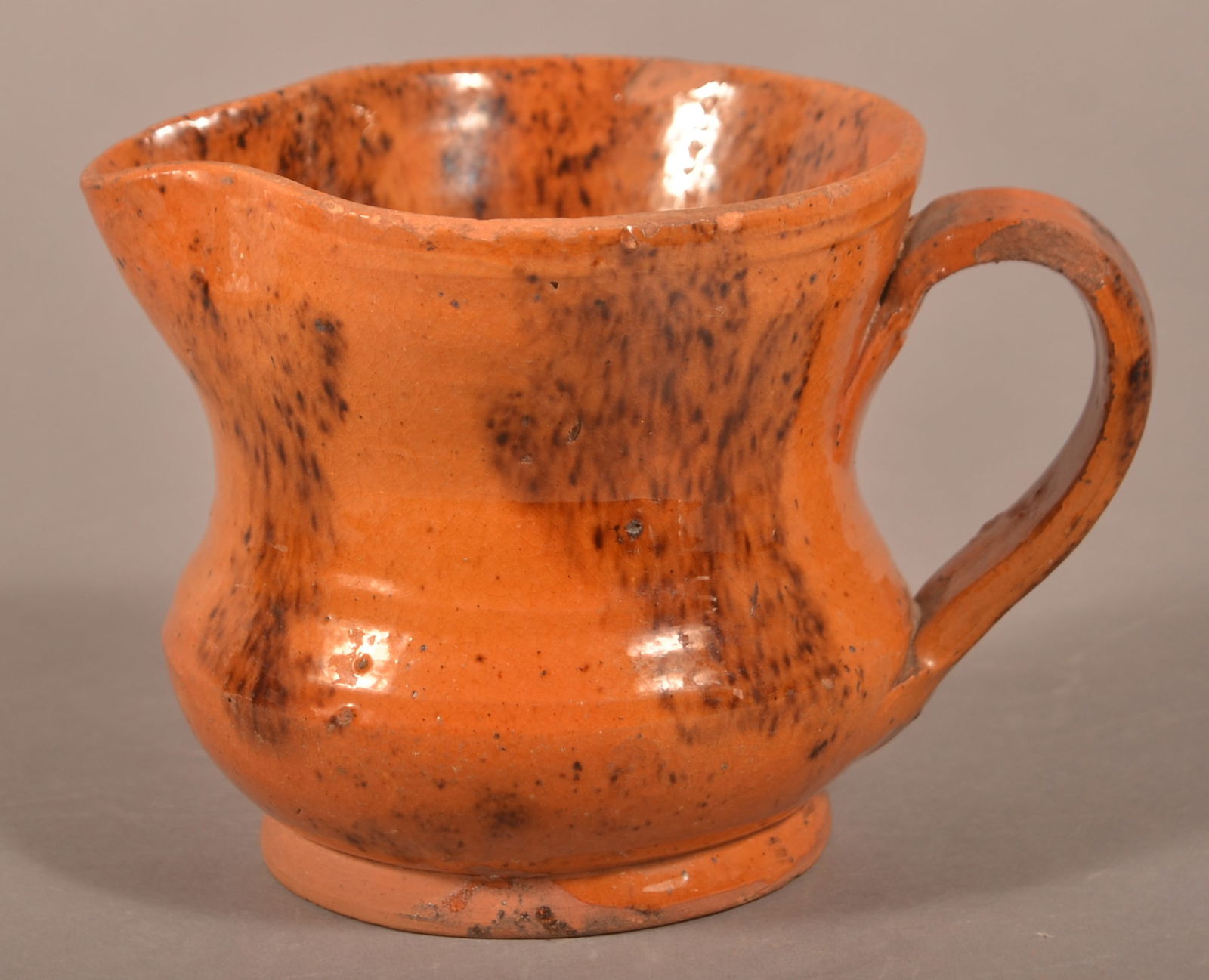 PA 19th C. Mottled Glaze Redware Cream Pitcher. (1 of 3)