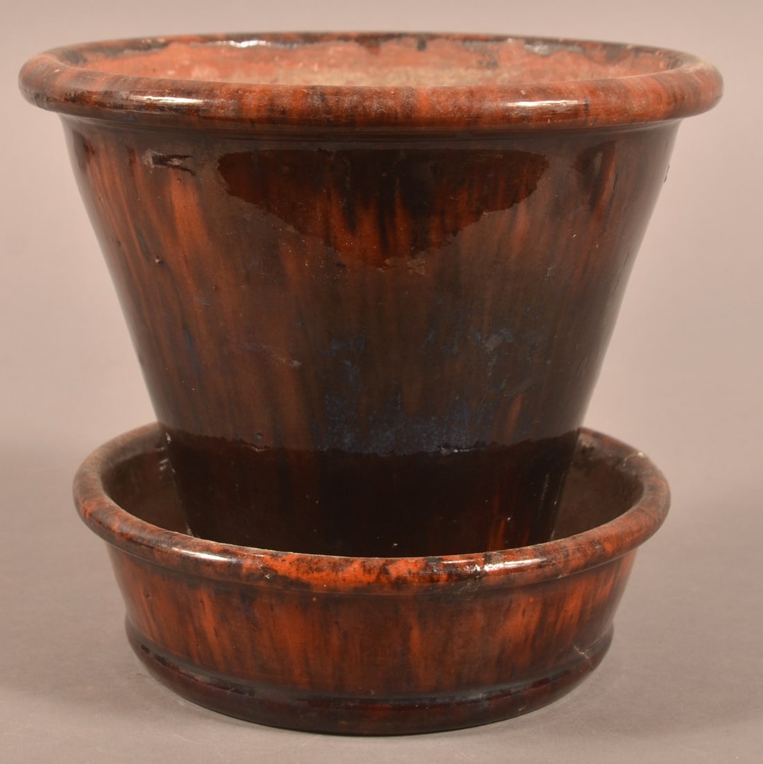 John Bell Mottled Glaze Redware Flowerpot.: John Bell Mottled Glaze Redware Flowerpot. Rounded rim with tapered body and attached saucer base. 6"h. x 6-3/4" diam.