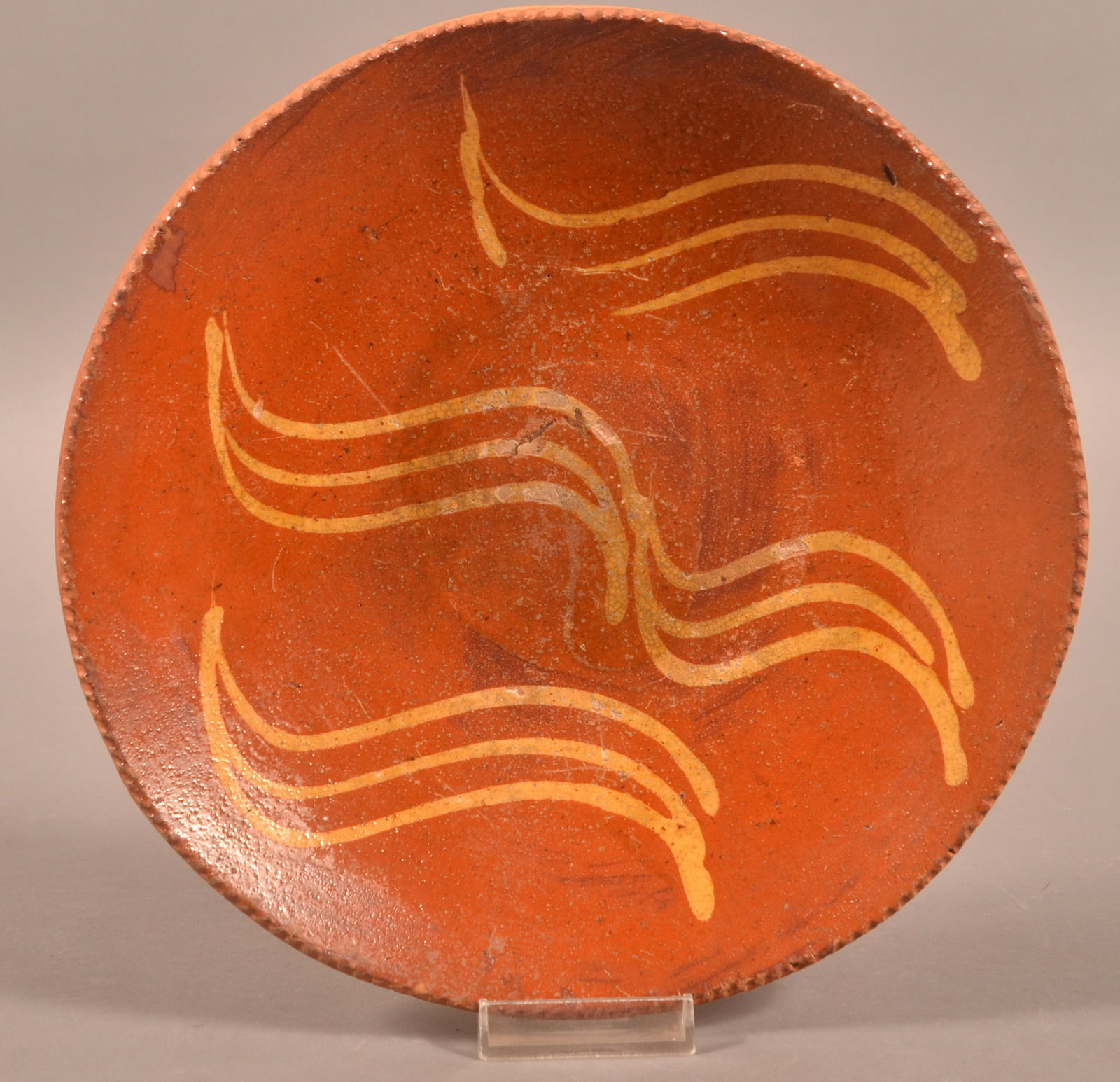 PA 19th C. Yellow Slip-Decorated Redware Plate.: Pennsylvania 19th Century Yellow Slip-Decorated Redware Plate. Coggle-wheel edge with squiggle-line decoration. 9-1/2" diam.