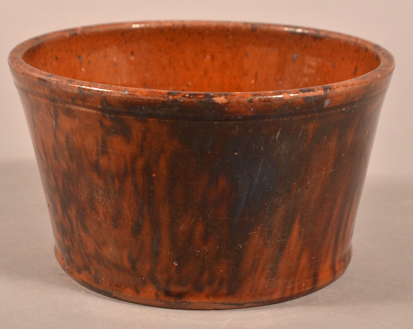 John Bell Glazed Redware Tapered-Side Bowl.: John Bell Mottled Glaze Redware Tapered-Side Bowl. Molded rim. 3-3/4"h. x 6-3/8" diam.