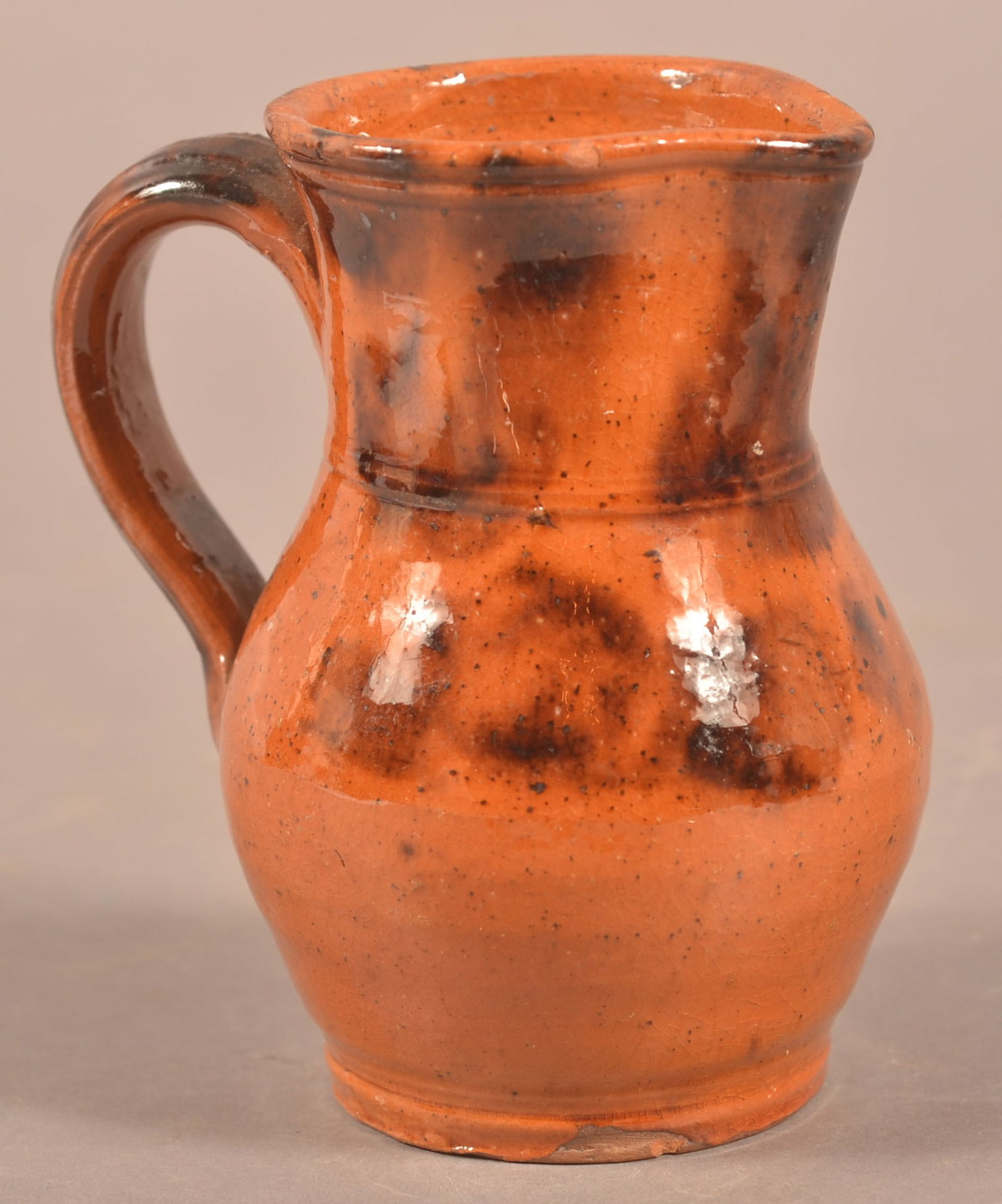 PA 19th C. Mottled Glaze Redware Cream Pitcher. (1 of 3)