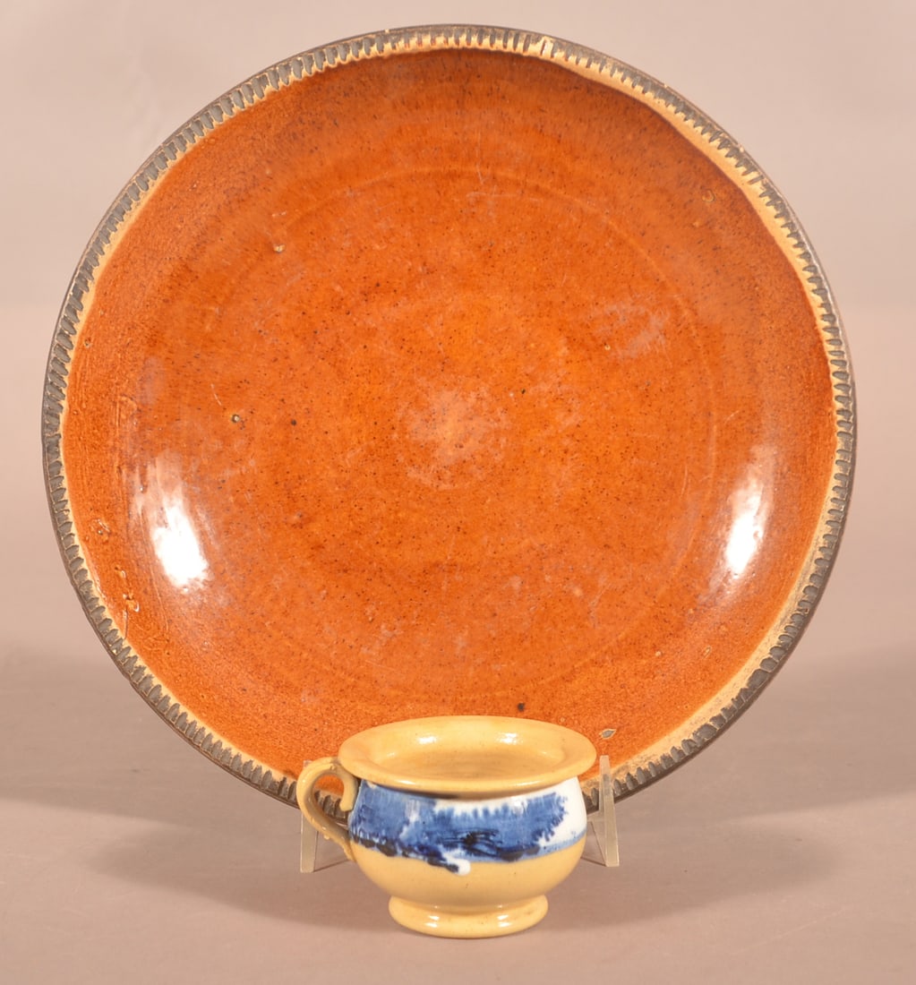 Yellowware Child's Seaweed Cup.: Yellowware Child's Seaweed Cup. Diminutive cup is 1-7/8" high. Together with a redware plate, coggled edge. 10" wide.