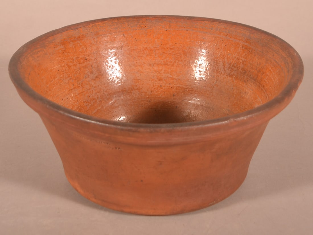 D.M. Baker's Interior Glazed Redware Bowl.: Rare D.M. Baker's Pottery Interior Glazed Redware Bowl. Stamped "D.M. BAKER'S POTTERY / WAYNESBORO, PA". Circa 1875. 5"h. x 11-1/4" diam. Provenance: The late Ronald E. Hammer, New Oxford, PA.