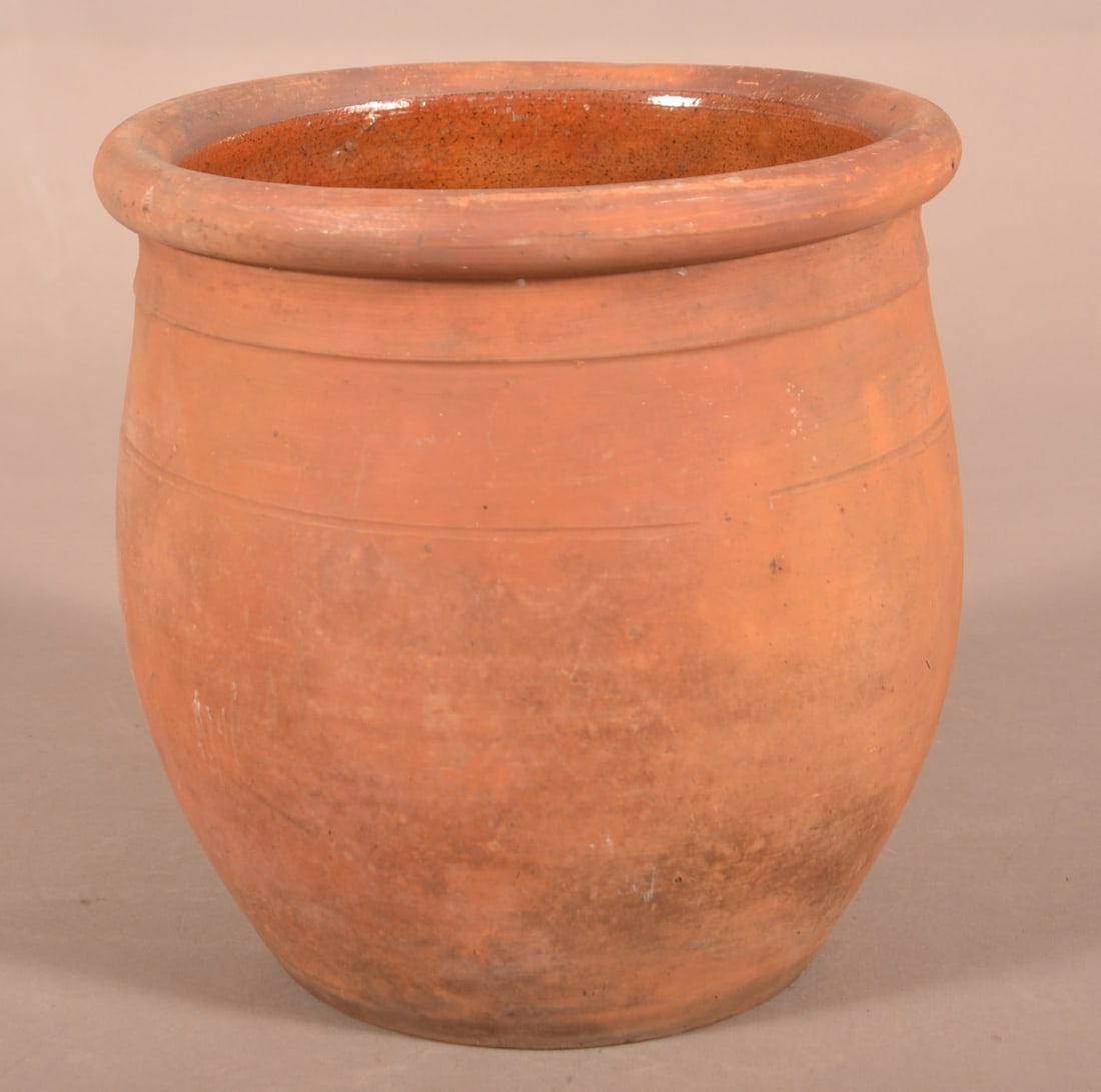 H. Utz Ovoid Redware Crock.: H. Utz Ovoid Redware Crock. York County, PA, second half 19th century. Tooled shoulder, rounded rim, and lead-glazed interior, the underside impressed "H. UTZ". 8-1/4"h. Provenance: The late Ronald E.