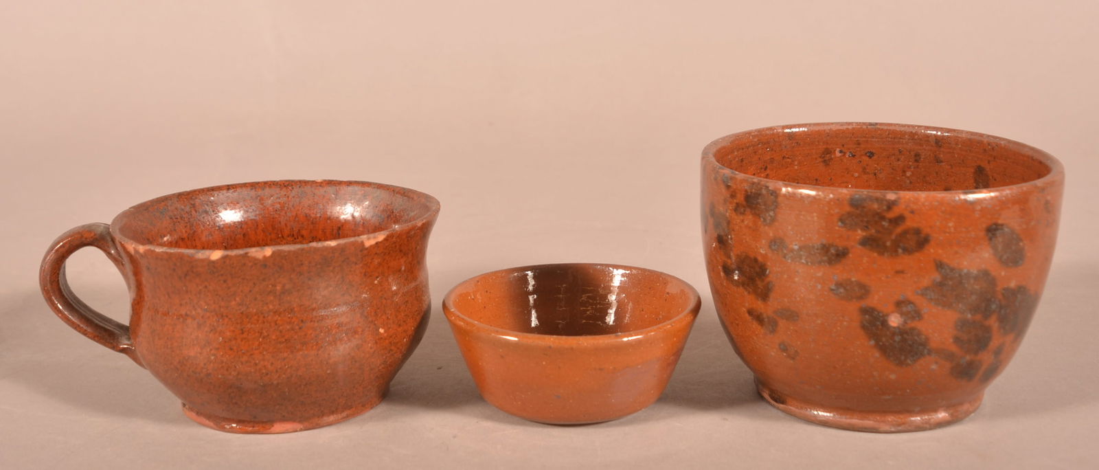 Three Antique Glazed Redware Vessels.: Three Antique Glazed Redware Vessels. Largest, 3-3/4"h. Provenance: The late Ronald E. Hammer, New Oxford, PA.