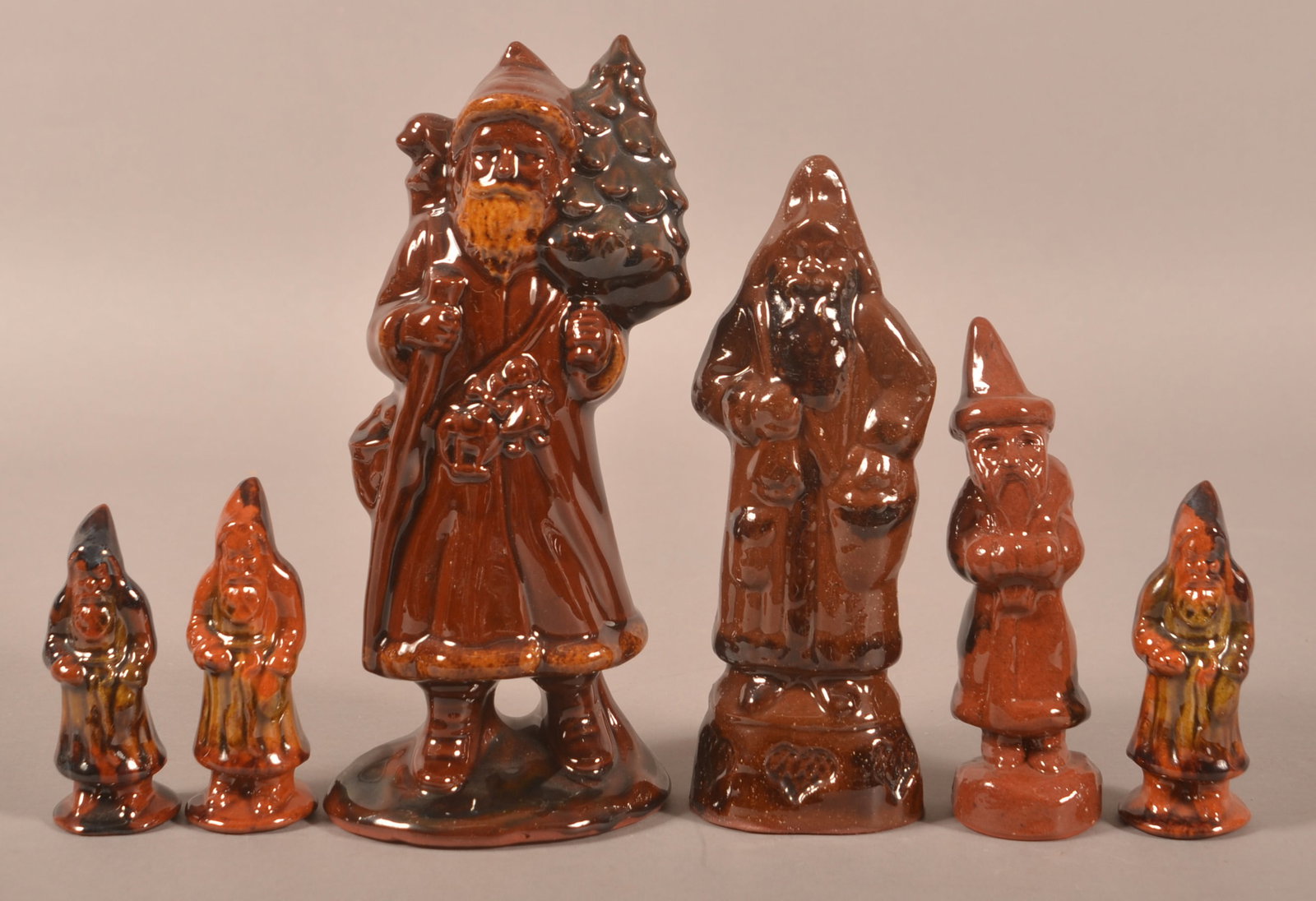 Six Contemporary Redware Molded Belsnickels.: Six Contemporary Redware Molded Belsnickels. Various potters. Measure 4" to 9-1/2"h.