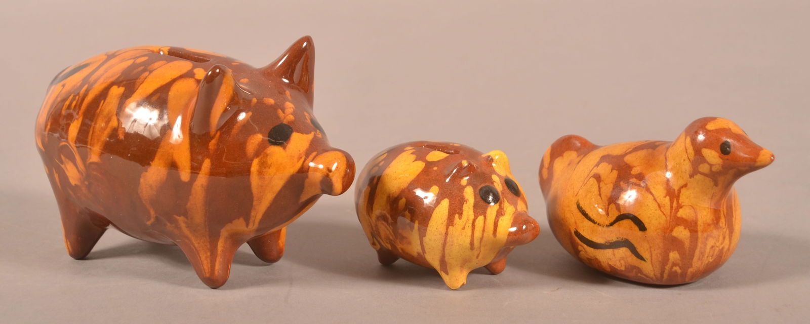 Three Lester Breininger Redware Banks.: Three Lester Breininger Redware Banks. Small pig, 3-1/2"l., initialed and dated "75", large pig initialed and dated "76", 6"l., and bird initialed and dated "78", 4-1/2"l.