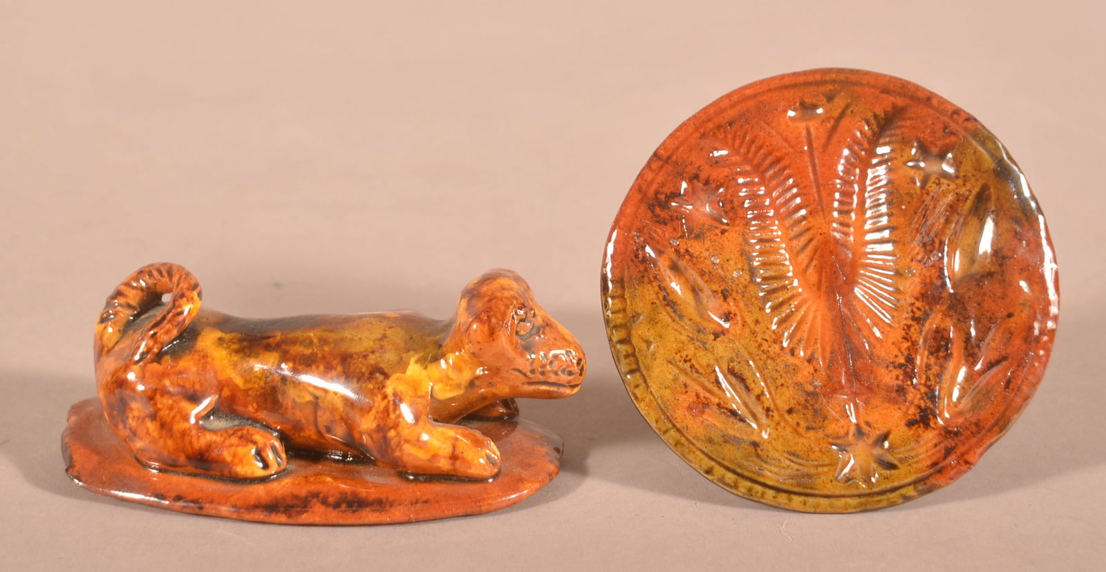 Breininger Redware Pottery Dog and Butter Print.: Lester Breininger Redware Pottery Dog and Butter Print. Dog is marked "L.B. 1975", 4-3/4"l. and tulip butter print is marked "L.B. 74"., 4" diam. Provenance: The late Ronald E. Hammer, New Oxford, PA.